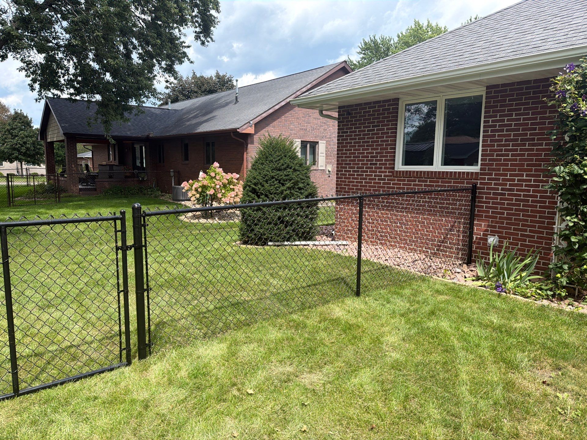 Residential White Vinyl Privacy and Black Chain Link Fencing in Jesup by Perfect Picket Fence and Stain