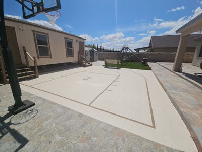 Exterior Building Painting and Repairs with Basketball Court and Playground