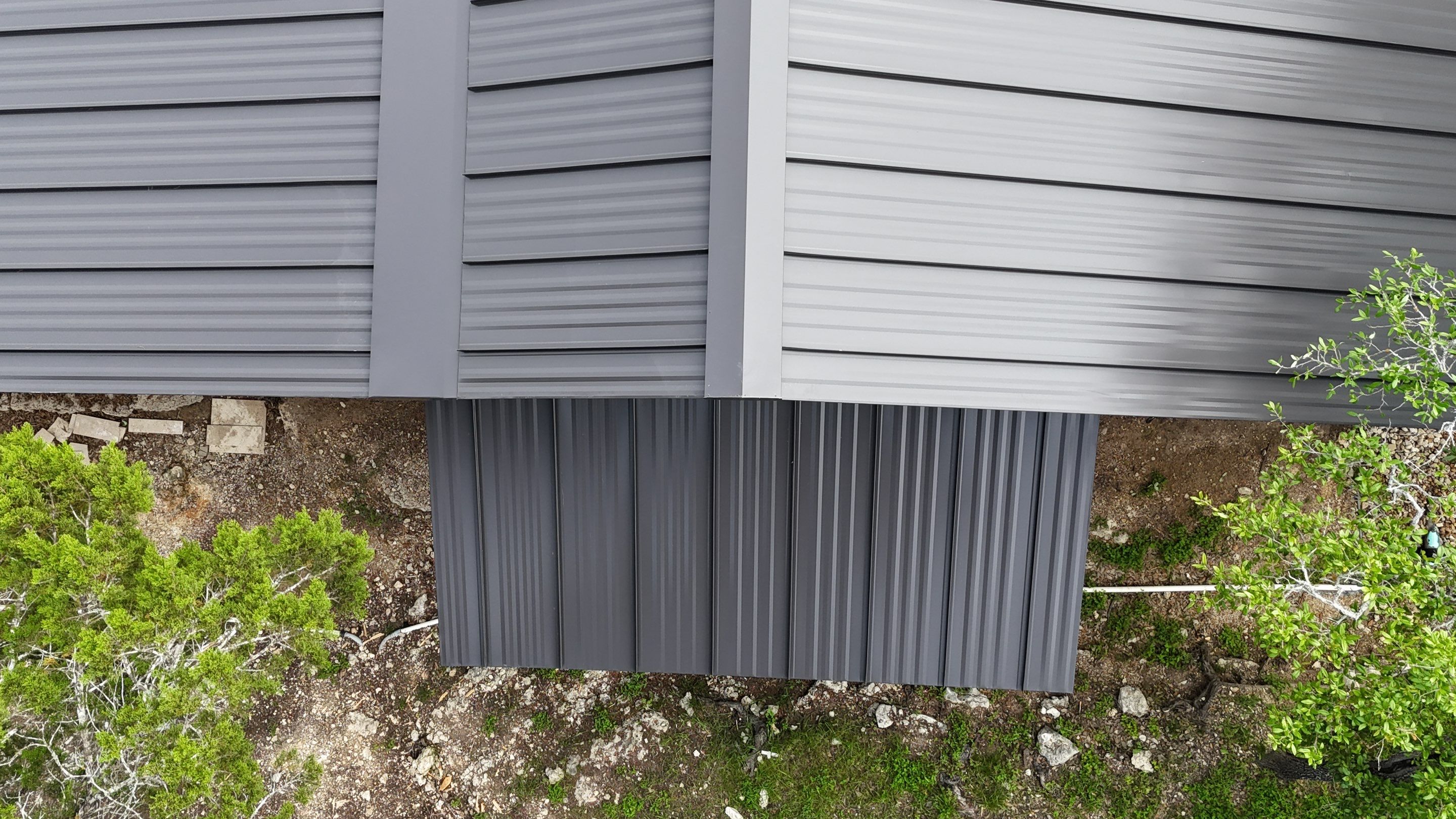 Dark Bronze Fully Striated panel by Wimberley Roofing