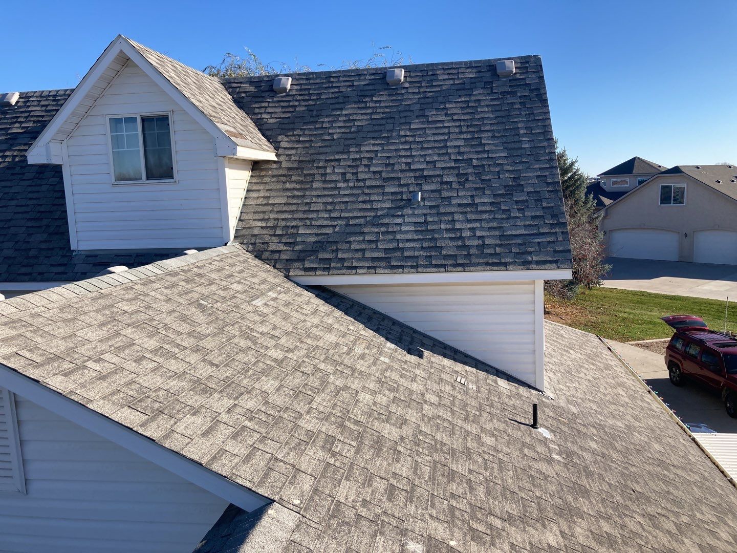 Two story farmhouse style roofing installation using Owens Corning Duration in the color Teak by ID Roofing LLC