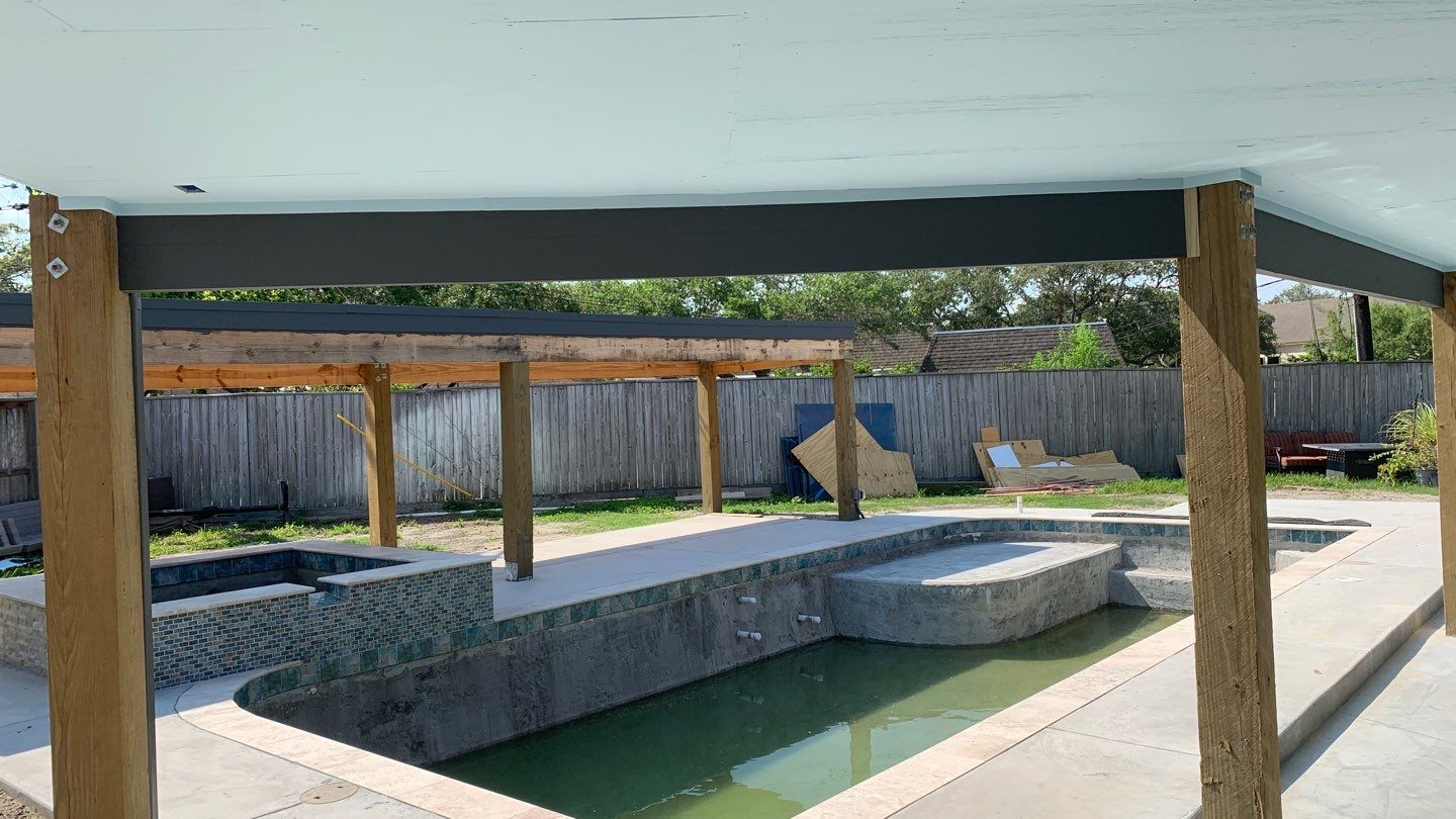 Beautiful pool side build by Bayfront Roofing and Construction