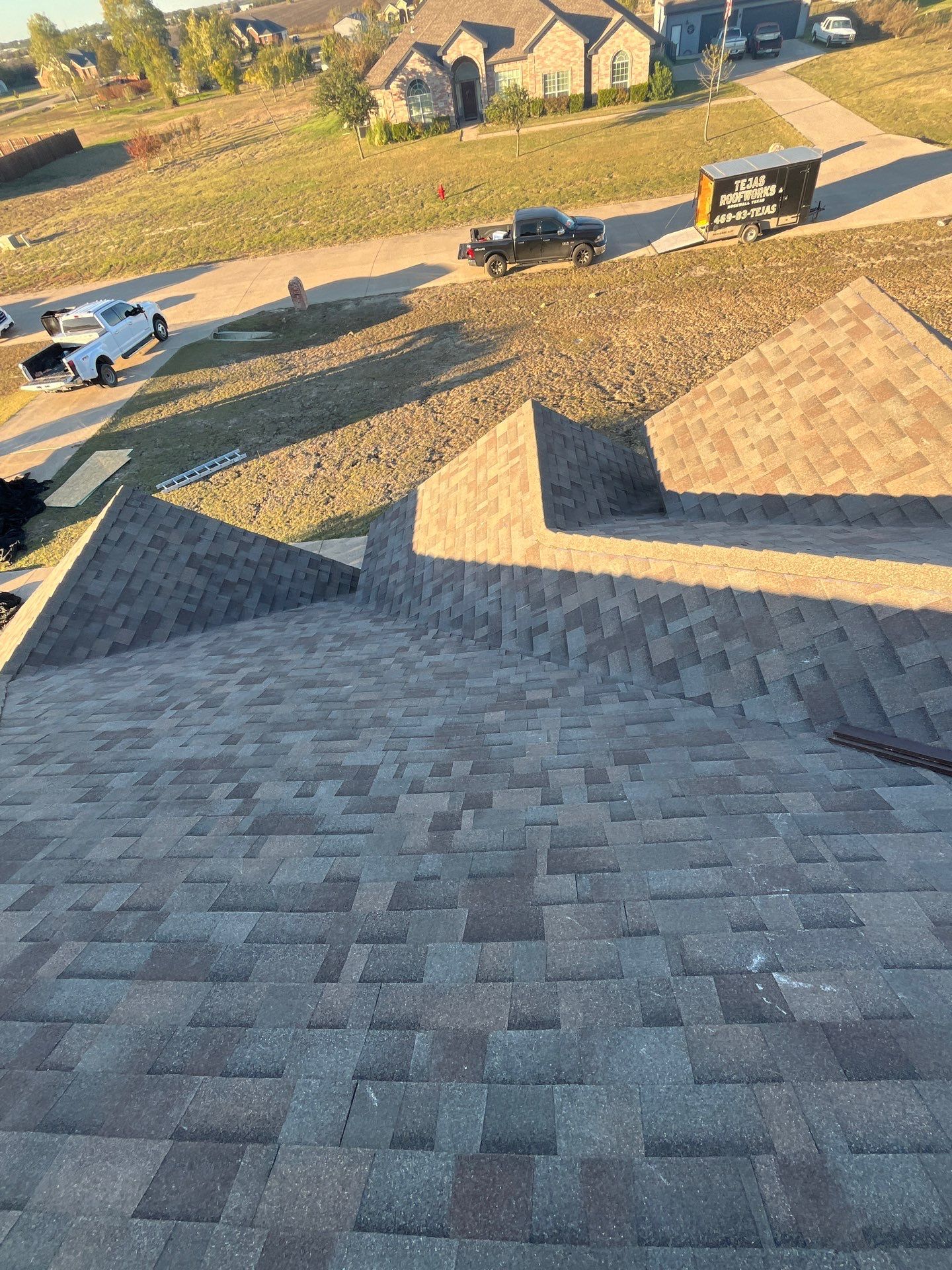 Brick with Malarkey Natural Wood by Tejas Roofworks + Restoration