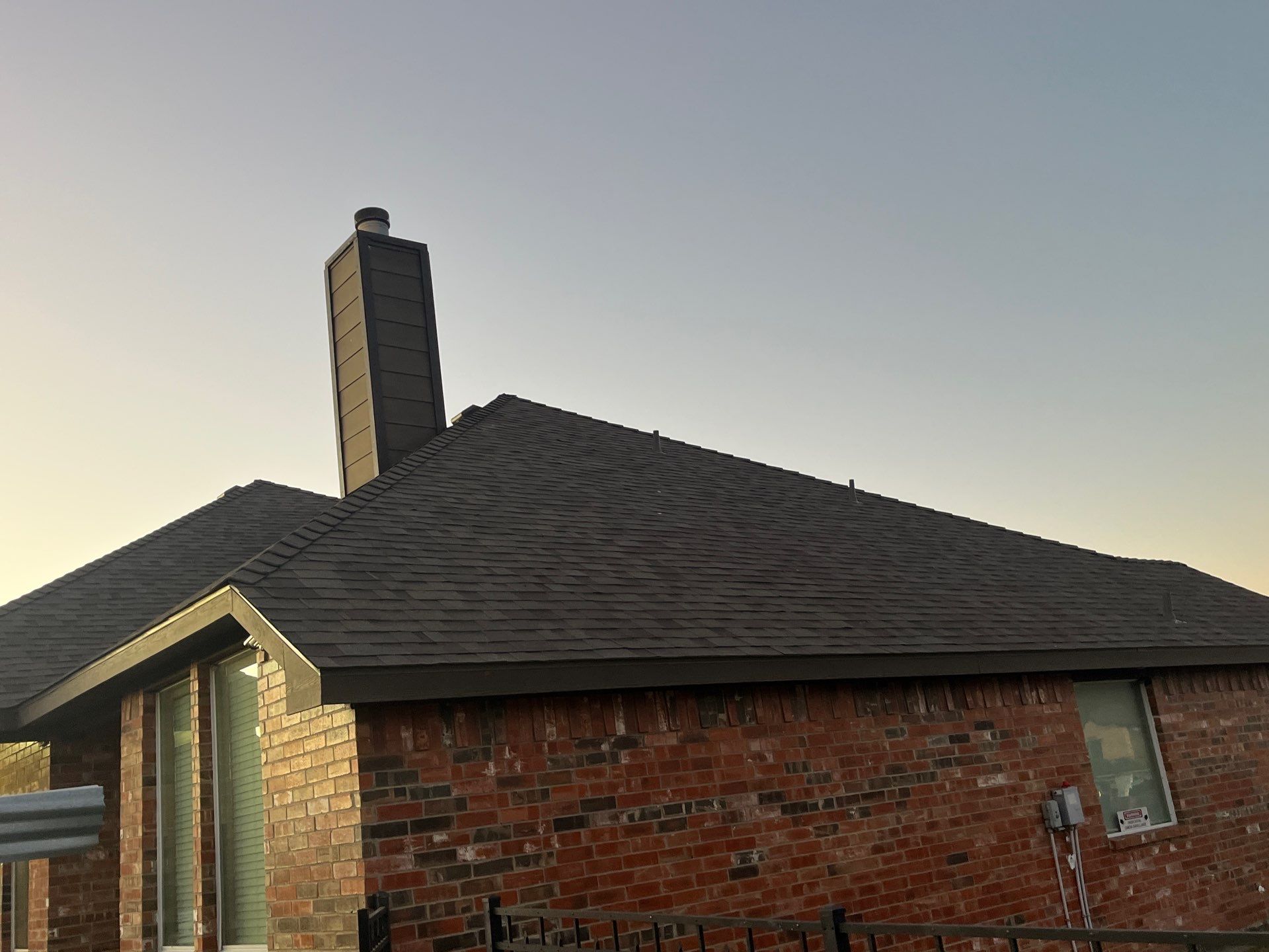 Brick with Malarkey Natural Wood by Tejas Roofworks + Restoration