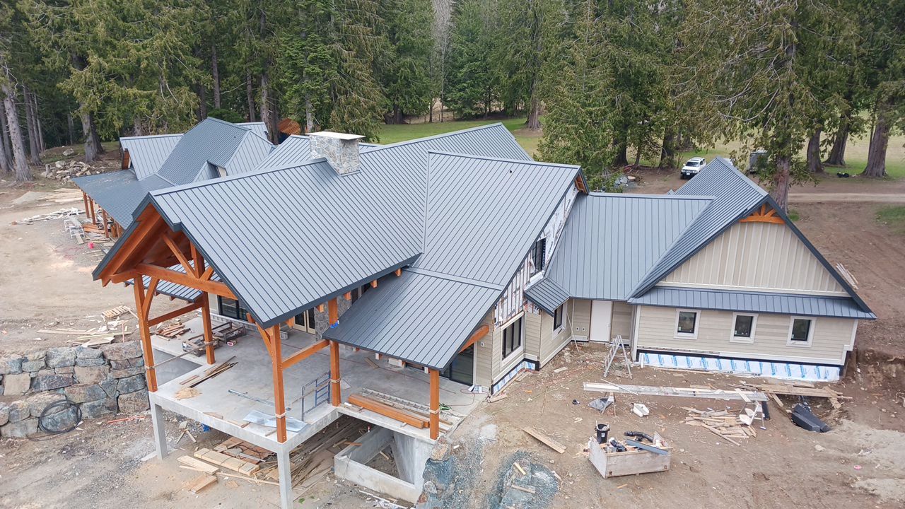 Residential Roofing Installation using 12" Prolok metal by Top Notch Roofing Inc