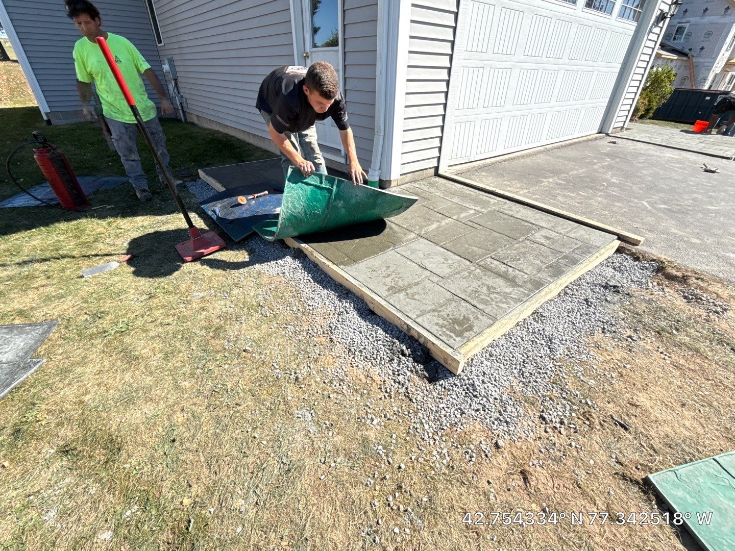 Stamped English Rivenstone concrete patio and sidewalks  by NG Masonry & Construction LLC