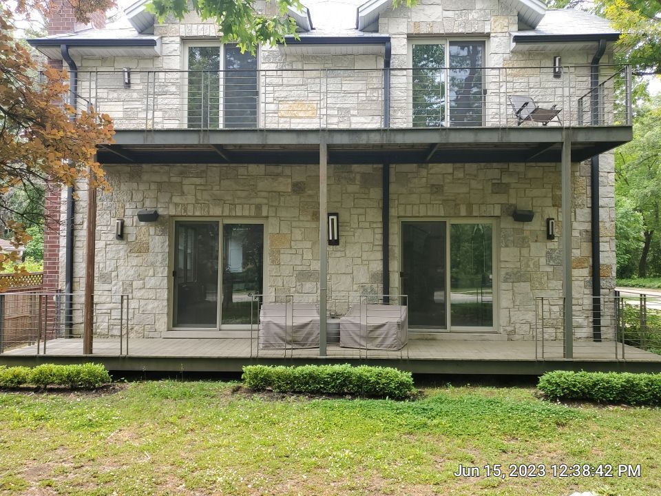 Highland Park, IL Bluestone, concrete,  Trex deck cleaning by Northern Power Washing LLC.