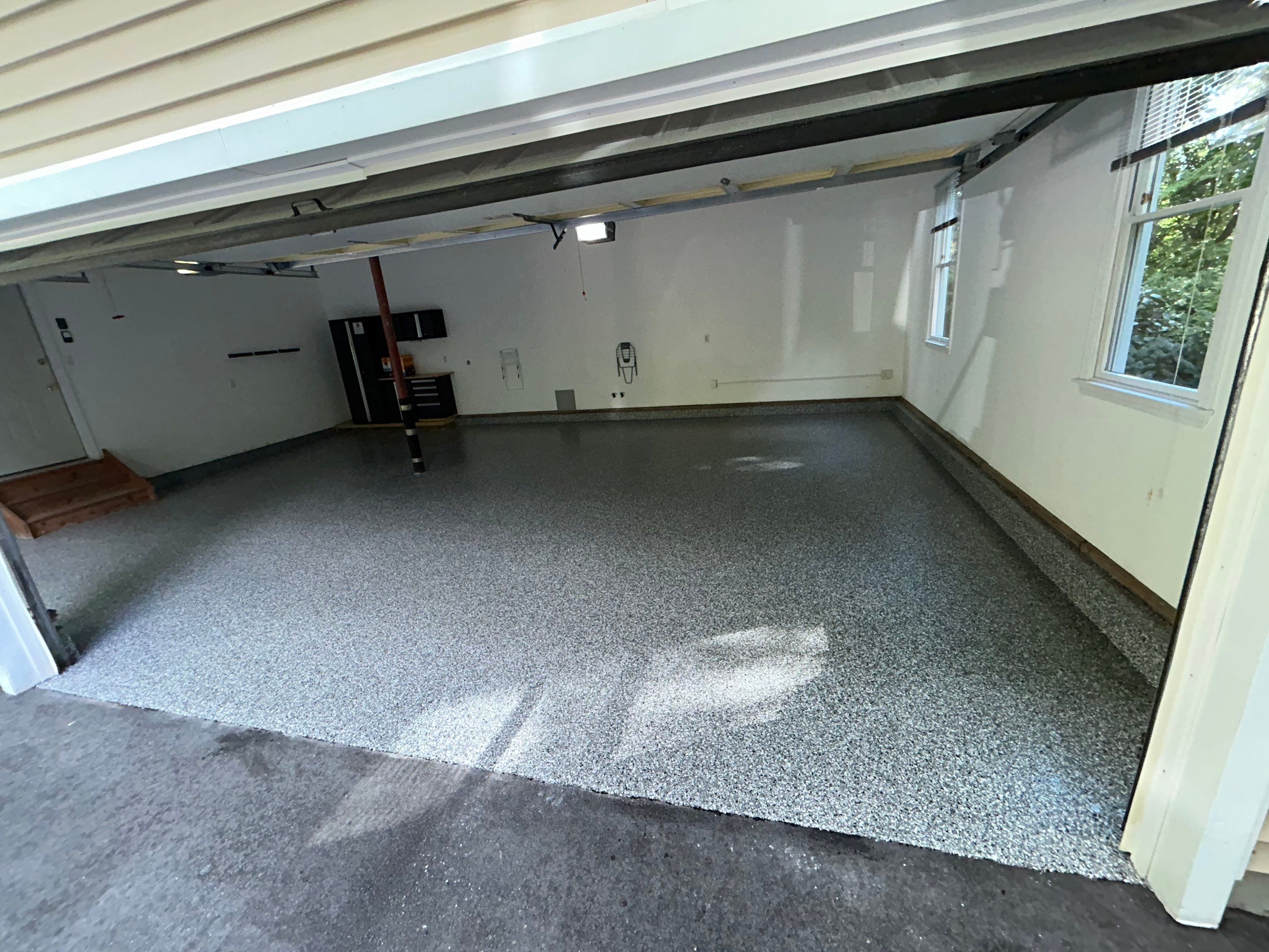 Wombat Concrete Floor Coating Transformation by DiGiorgi Roofing and Siding Inc