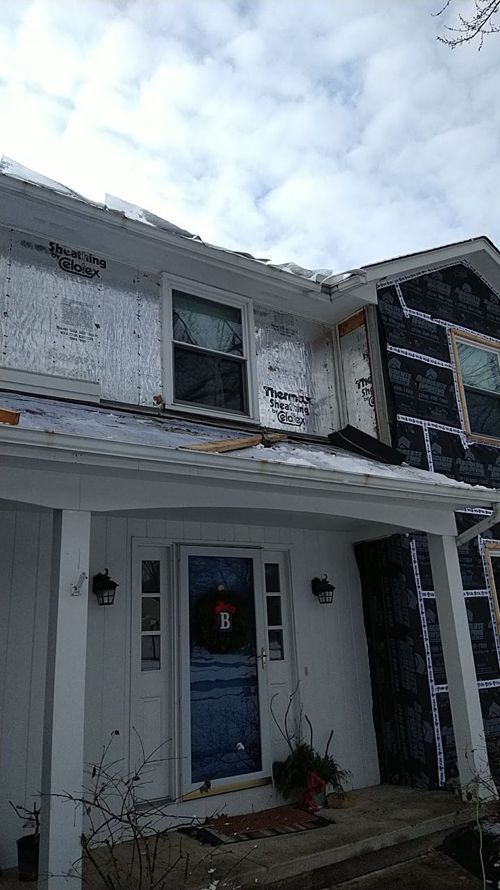 James Hardie Siding  using James Hardie Board and Batten, White by Absolute Roofing and Construction