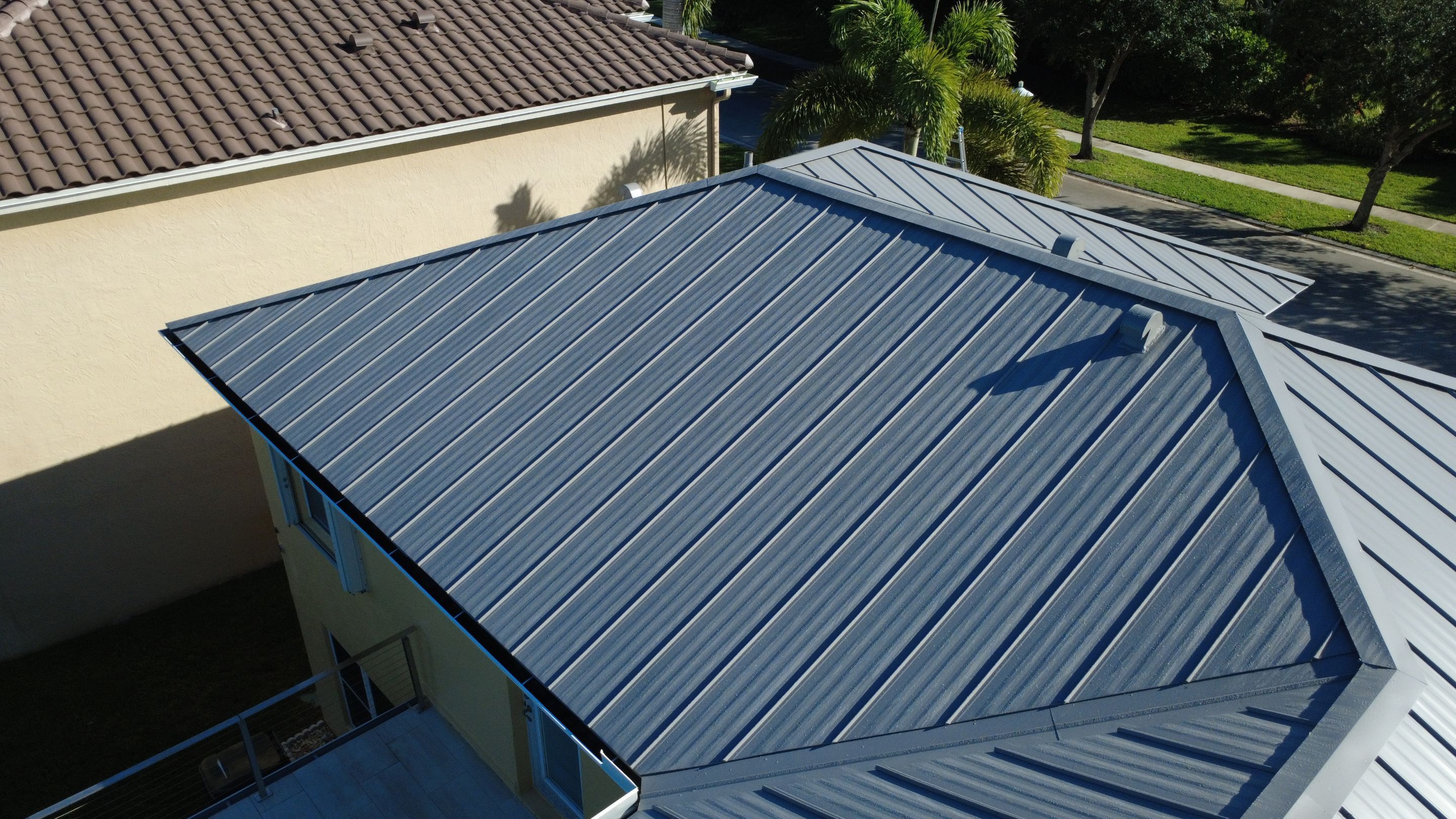 Residential Roofing Installation using 1" Nail strip metal roof by BLUES BROTHERS CONSTRUCTION CORP