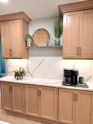 Modern Kitchen Remodel Featuring Quartz Backsplash, under cabinet lighintg, and a coffee bar in Mt. Juliet Tennessee