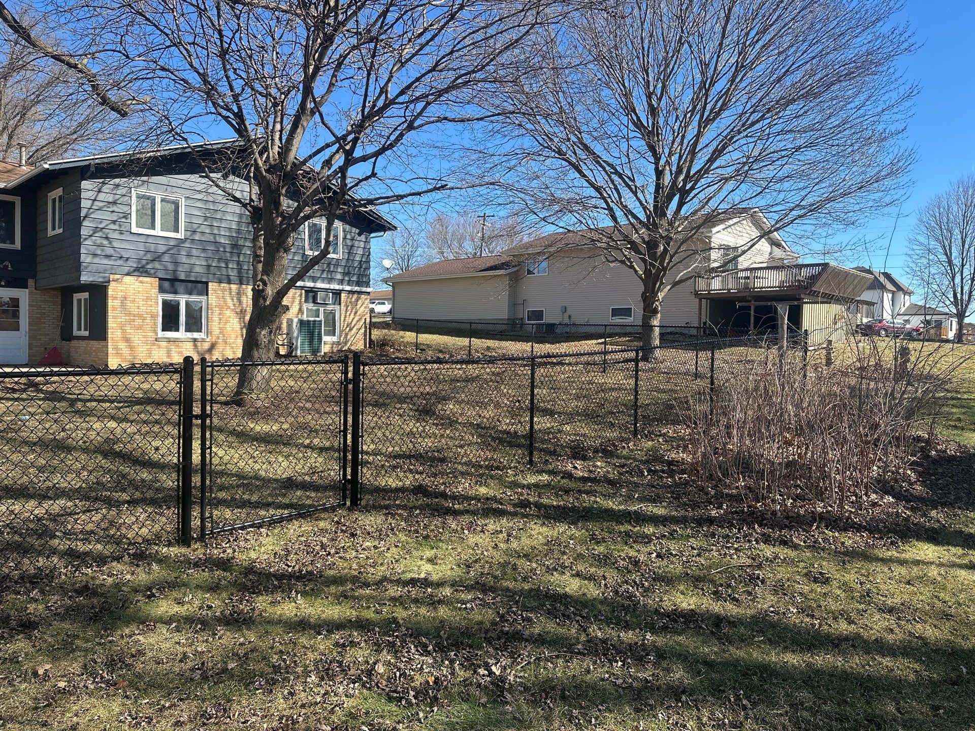 Black Chain Link Fence Installation with Double Gate in Grundy Center by Perfect Picket Fence and Stain