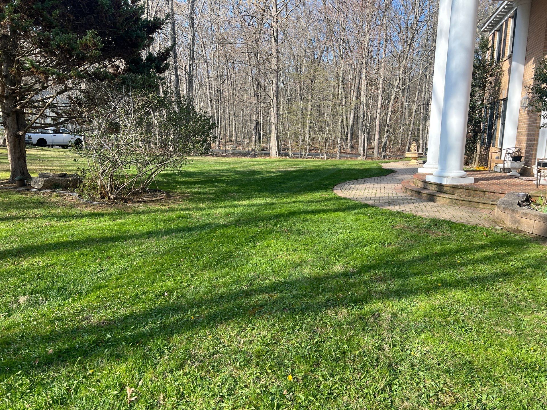 Lawn Care Visit at a Colonial-Style Home in Guilford, CT by Diamond Image LLC