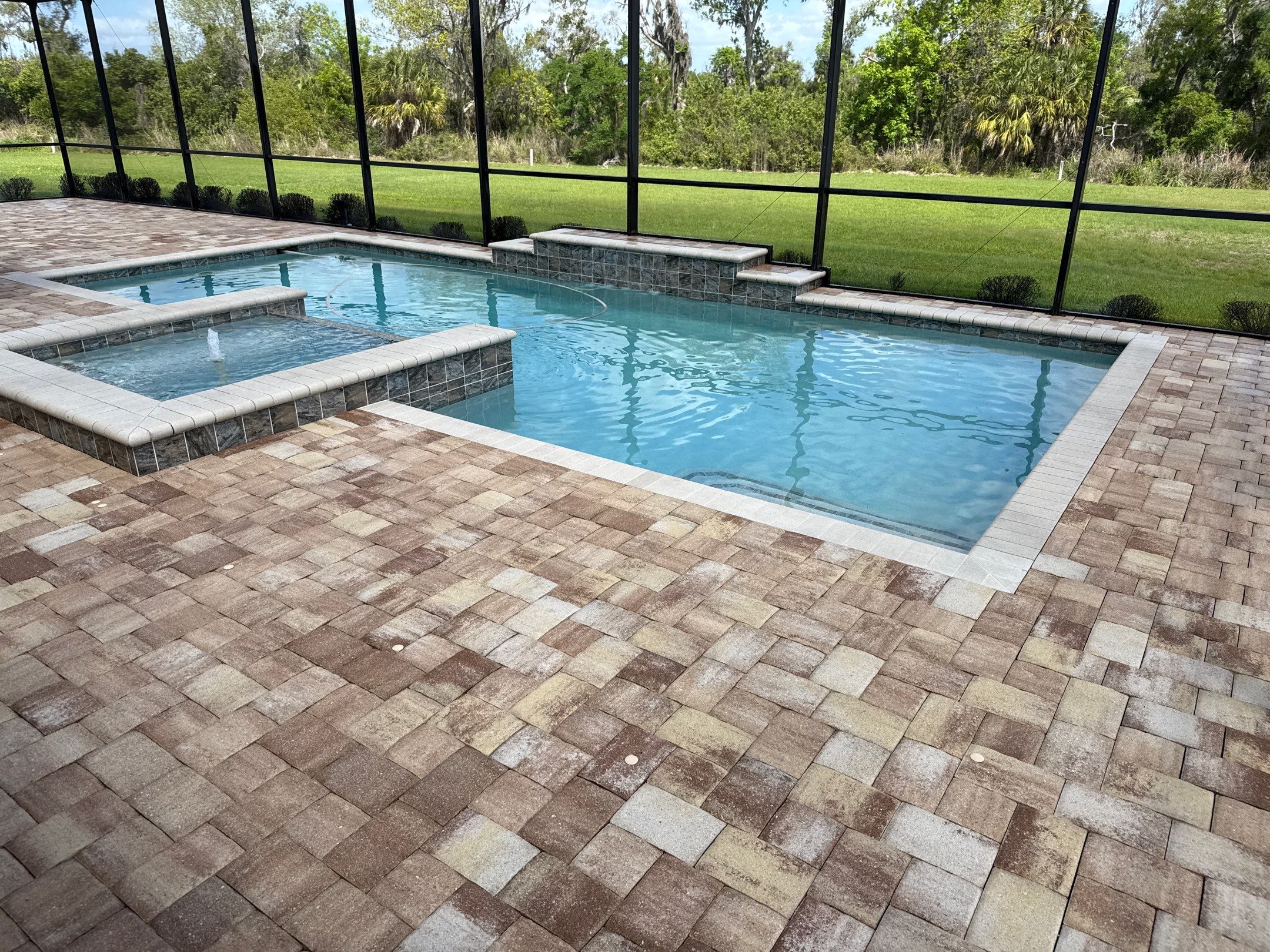 We recently completed a tile roof cleaning in the Vivienda at Bradenton community. The roof had visible algae buildup, which is common in Florida’s humid climate—especially on shaded areas.  For this project, we safely cleaned the roof using a ladder and ground-based soft wash application—no walking on the tile roof. This approach helps prevent cracked or broken tiles while still delivering a thorough, even cleaning.  Our soft washing process targets and eliminates algae at the root, restoring the roof’s appearance and helping extend its lifespan.  At Sunshine AquaWash, we prioritize safety, proper technique, and long-lasting results on every roof cleaning project. by Sunshine AquaWash