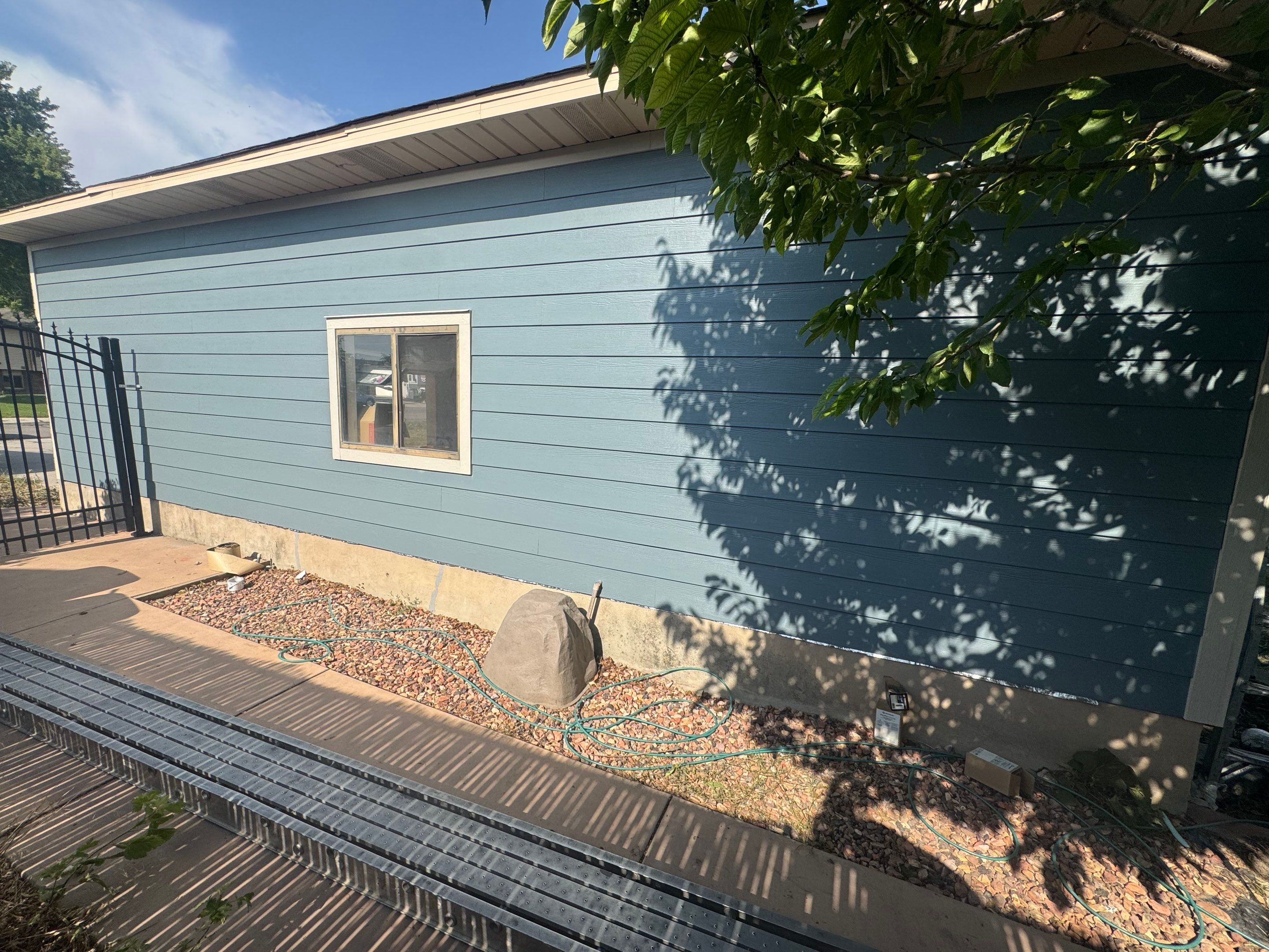 West Jordan | Hardie Lap Siding w/ Brick Accent | Boothbay Blue & Cobble Stone by Ideal Siding Utah
