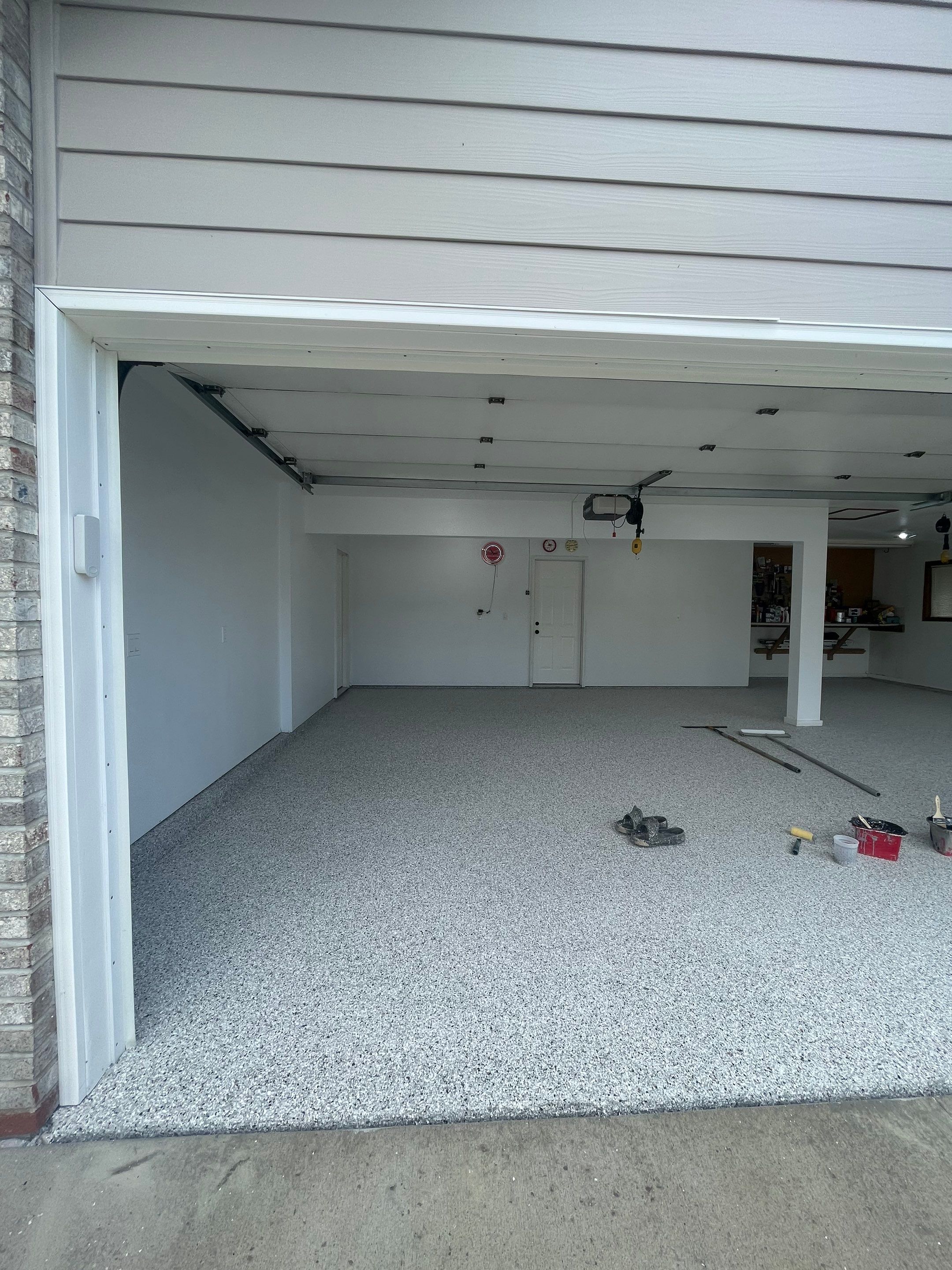 Multi-Car Garage Concrete Coating with Coyote Flake Finish in Sioux Falls by Select Painting, Coatings & Garage Cabinets