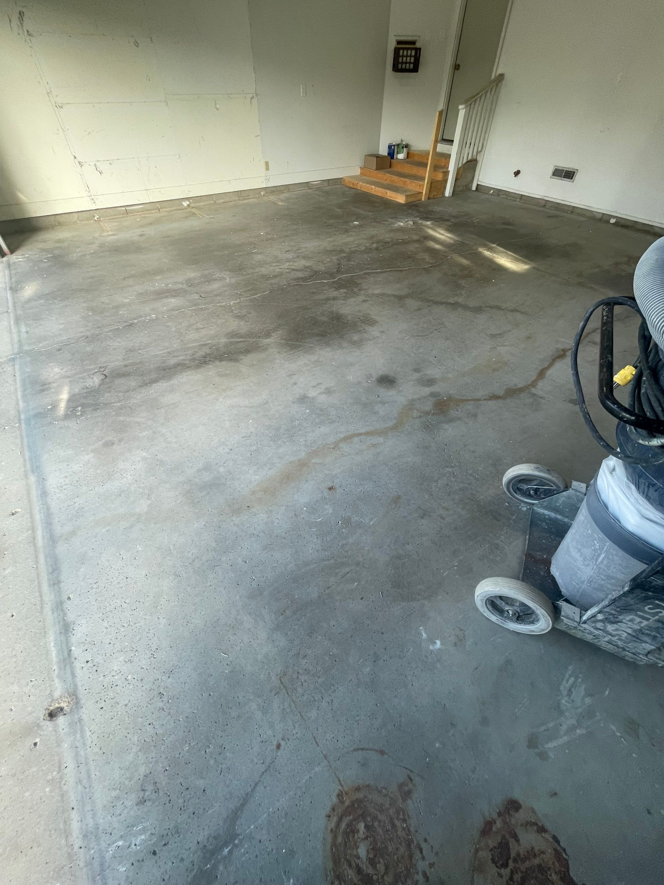 Grey Speckled Concrete Coating for Residential Garage in Yankton by Select Painting, Coatings & Garage Cabinets