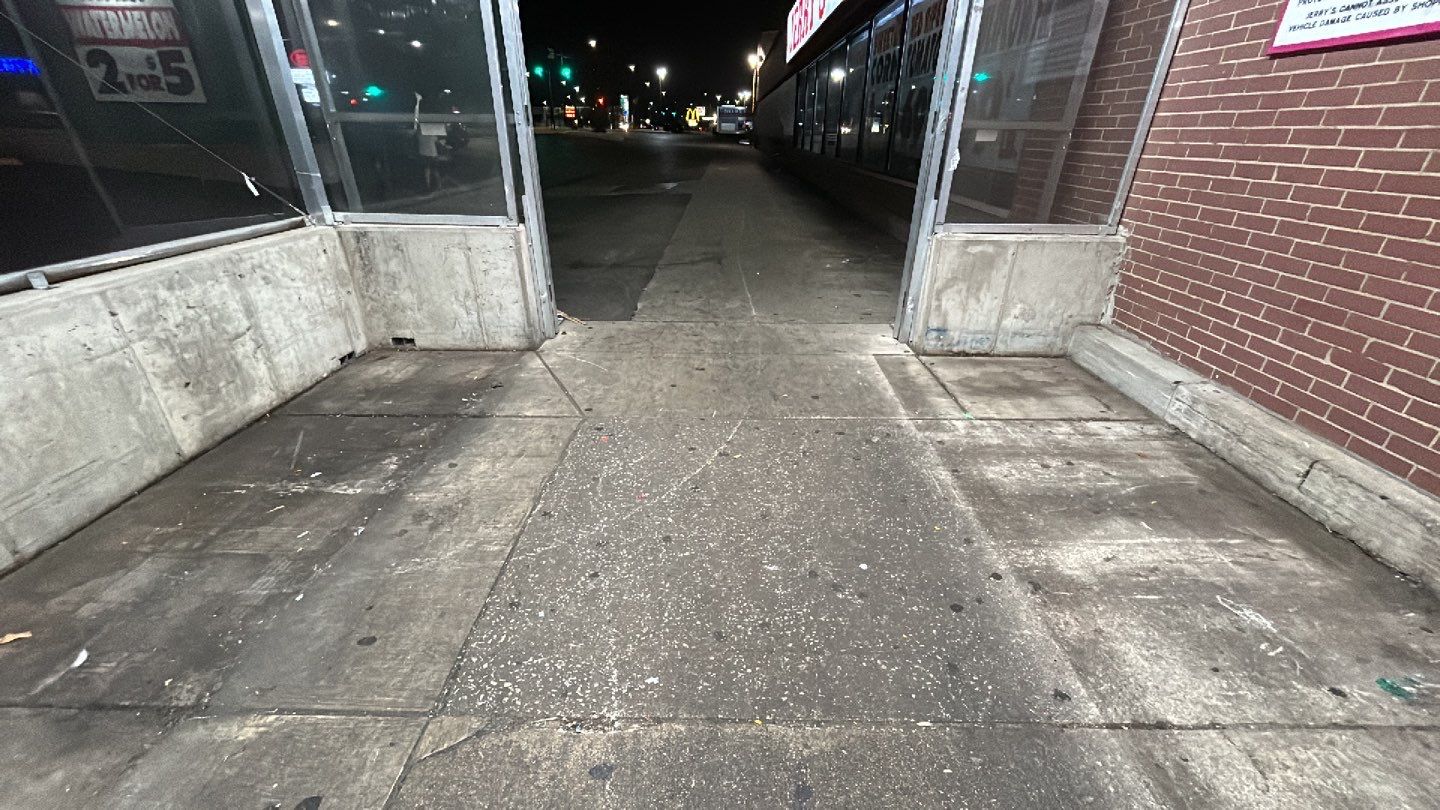 Concrete sidewalk cleaning and degreasing by Northern Power Washing LLC.