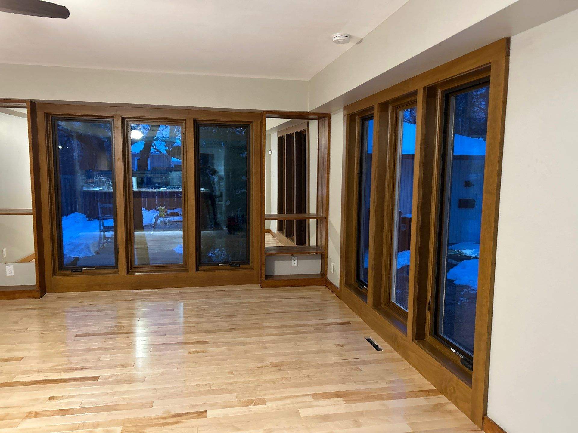 Black-Frame Pella Lifestyle Upgrade on a Partial Brick Home by United Windows and Siding LLC