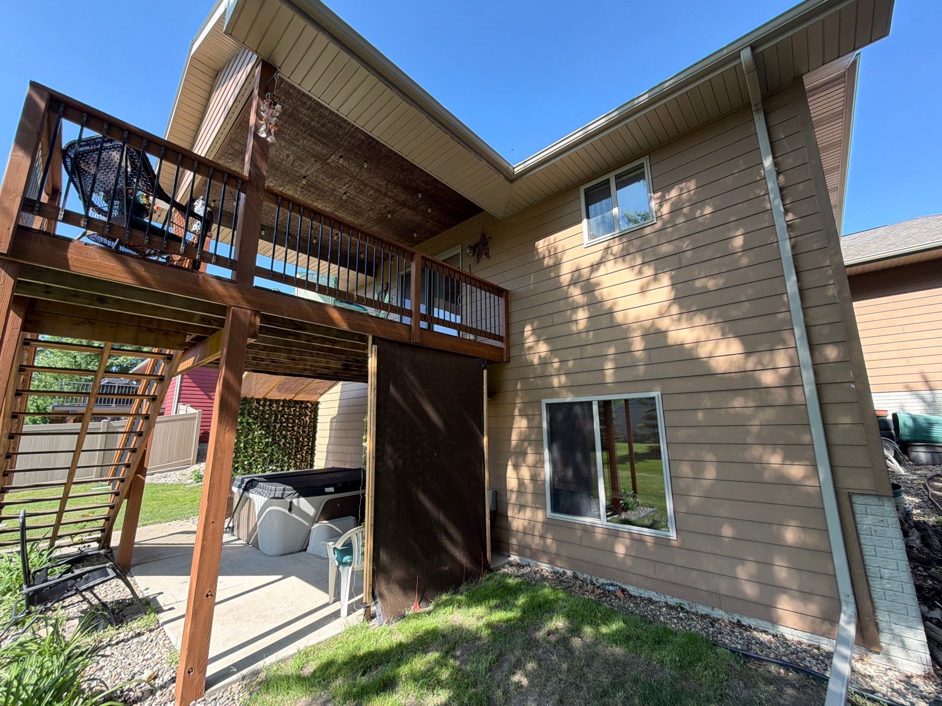 Full Exterior Residential Painting and Siding Refresh in Tea by Select Painting, Coatings & Garage Cabinets