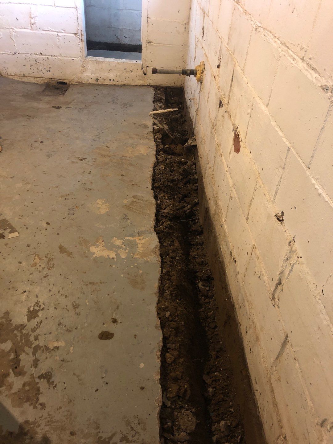 Basement Waterproofing using Drain tile system and a foundation wrap by ACE Waterproofing & Basement Solutions