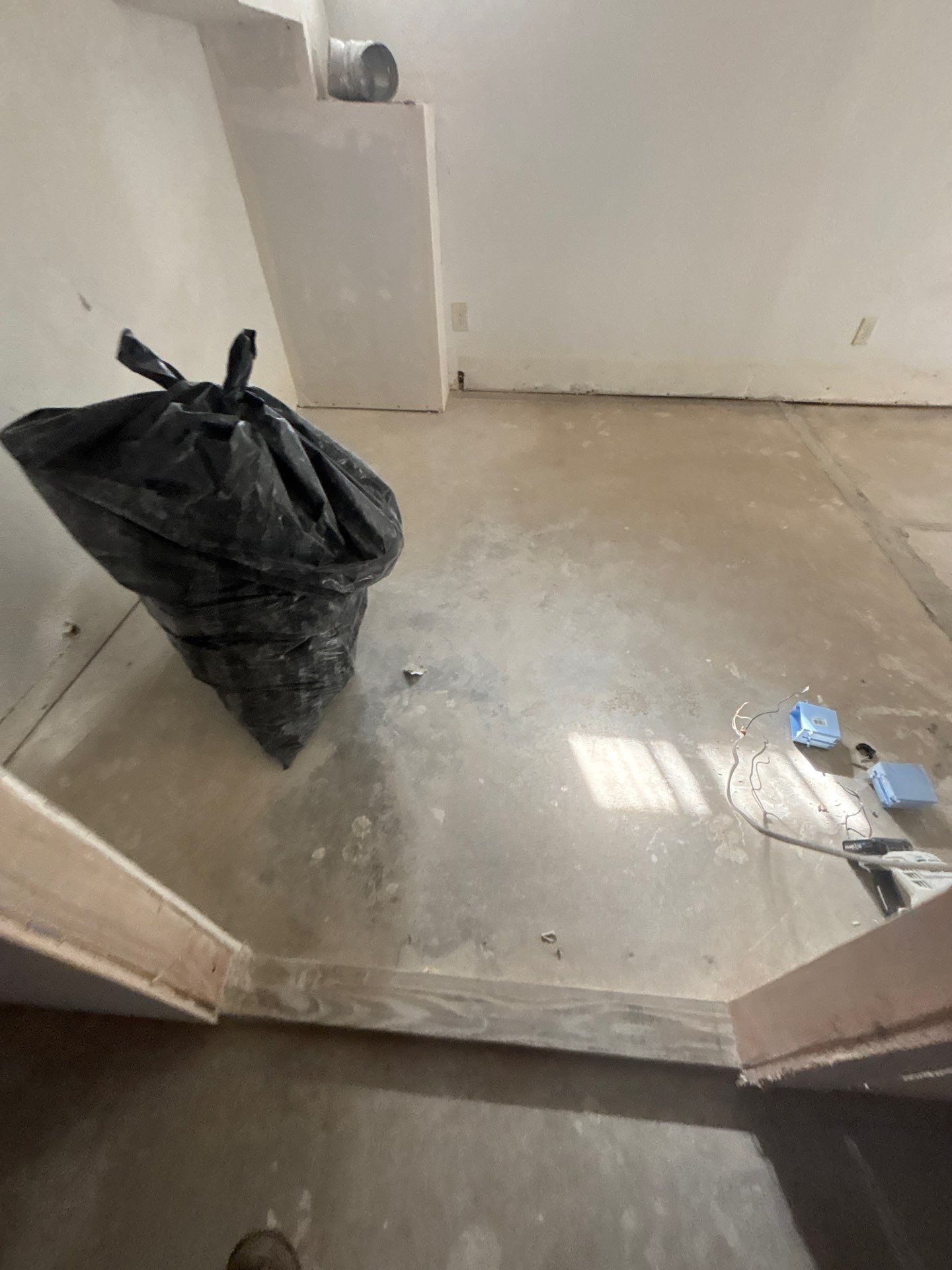 Comprehensive Basement Concrete Floor Coating and Crack Repair in Sioux Falls by Select Painting, Coatings & Garage Cabinets