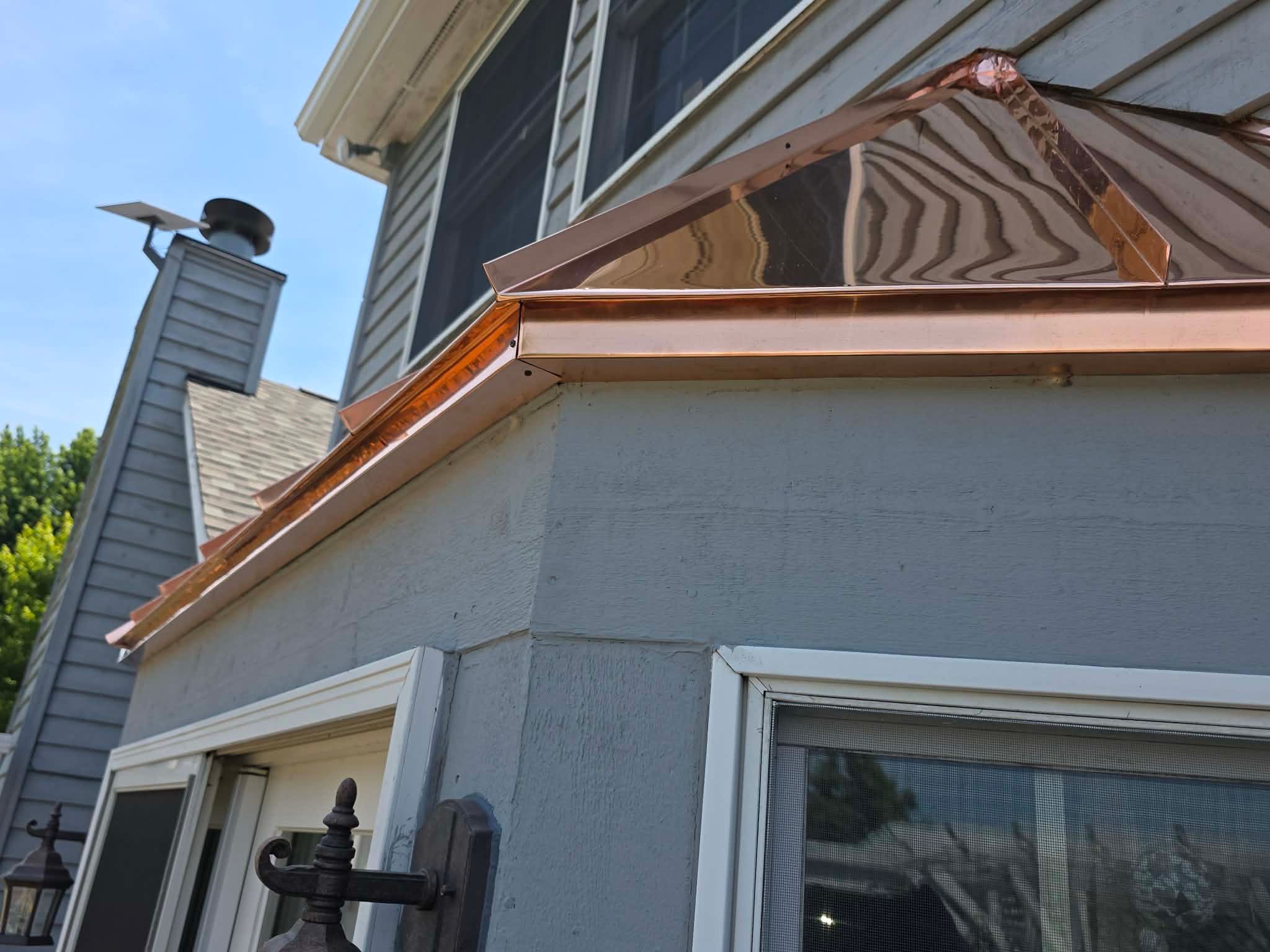 Roofing, copper chimney cap and copper awning by Optimal Home Improvement 