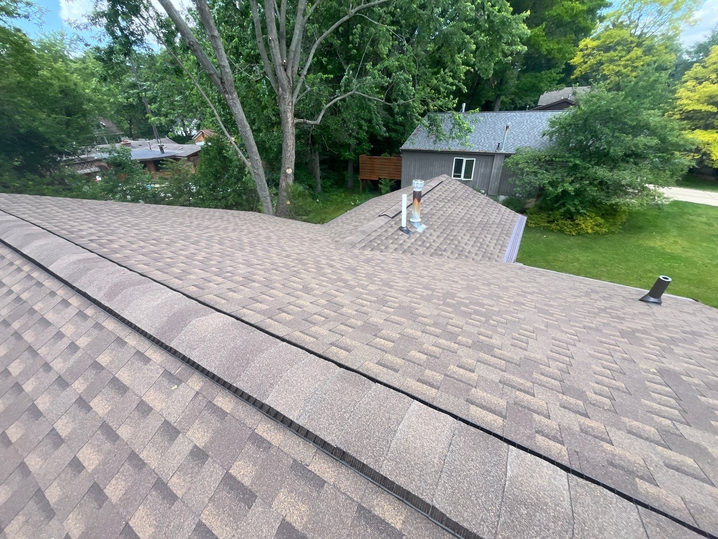 Installing new Roof and Gutter Protection after Hail Damage by Acme Exteriors