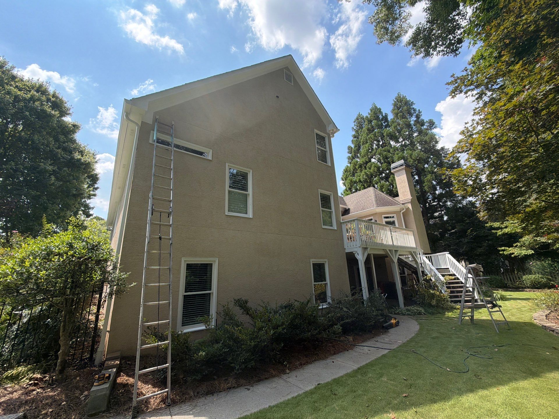 Multi-Story Stucco Home Exterior Painting and Garage Refresh in Marietta by Swift Home Renovations 