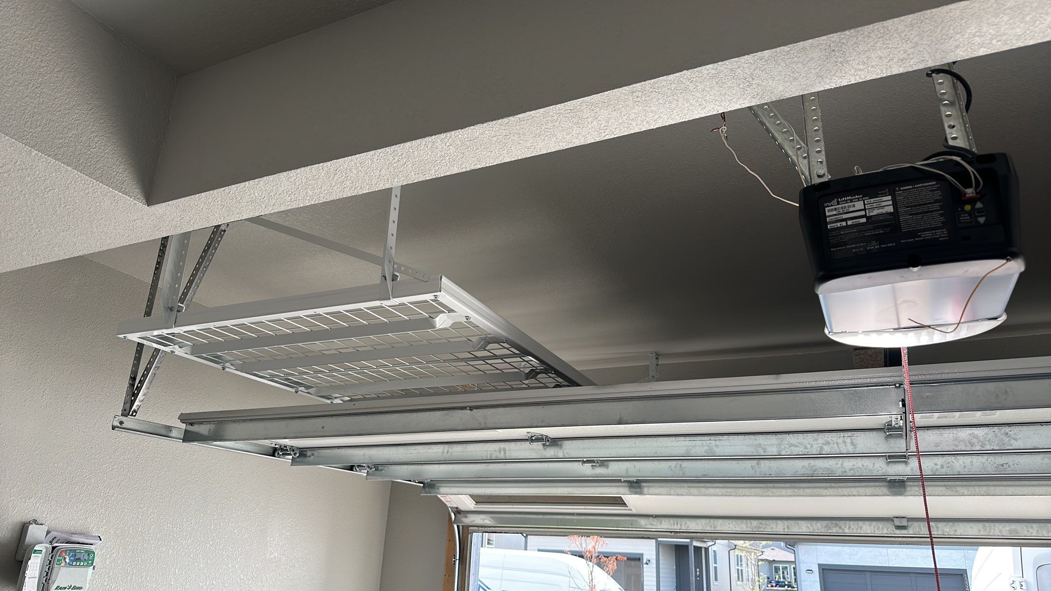 John H. maximized his storage with overhead racks and wall shelves by Banner Garage