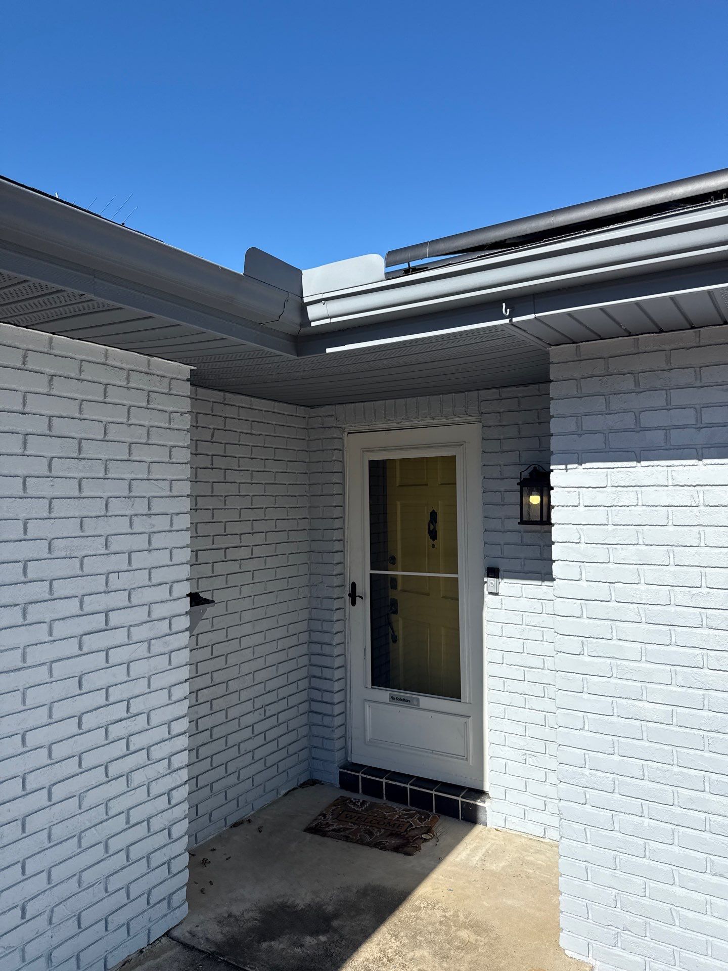 Downspout Installation using Downspout Extension and new Gutters in Winter Haven FL by Gutter Professors