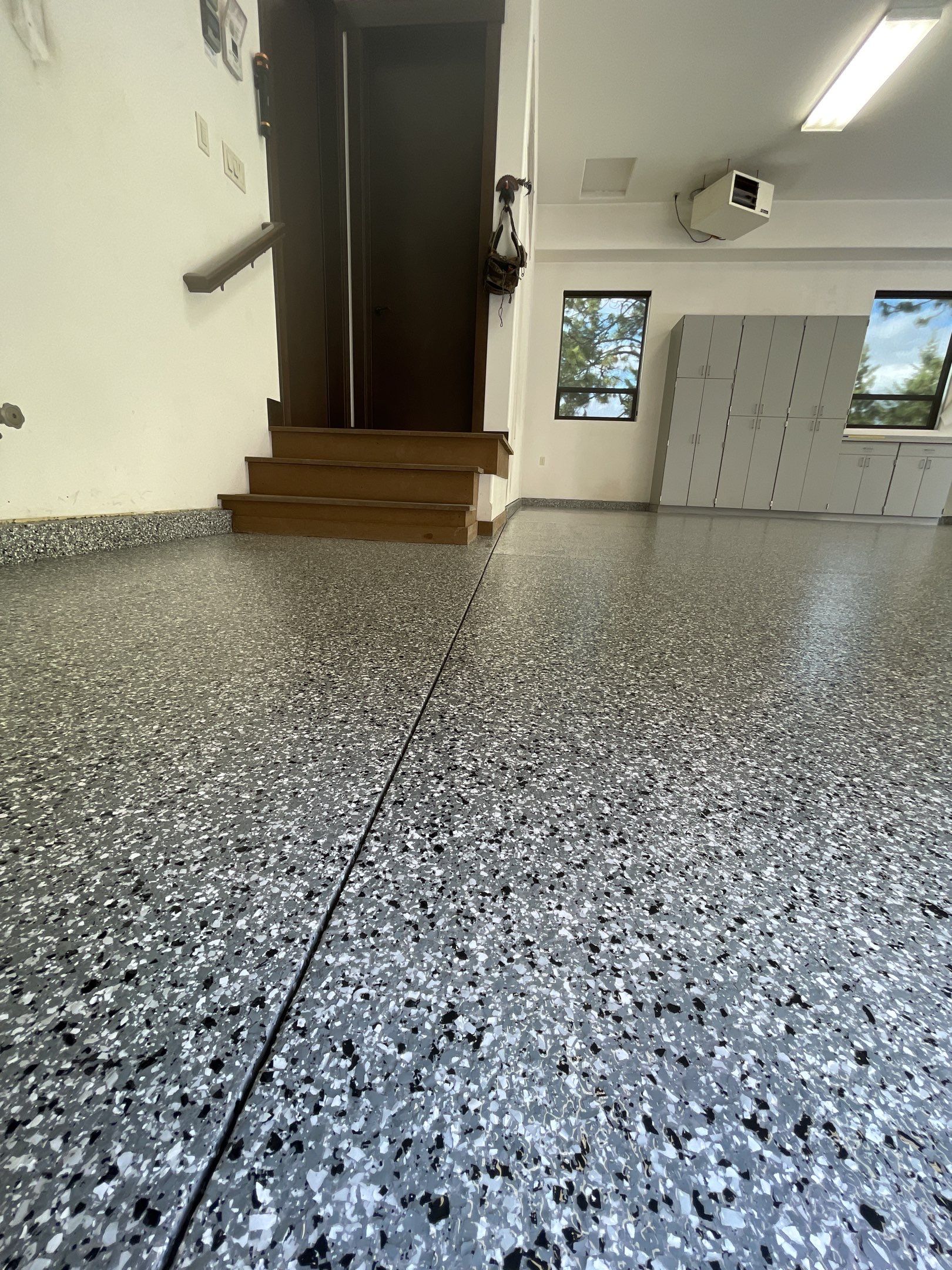 Garage Transformation using Smoke and the Penntek Evolution System by Croc Coatings, LLC
