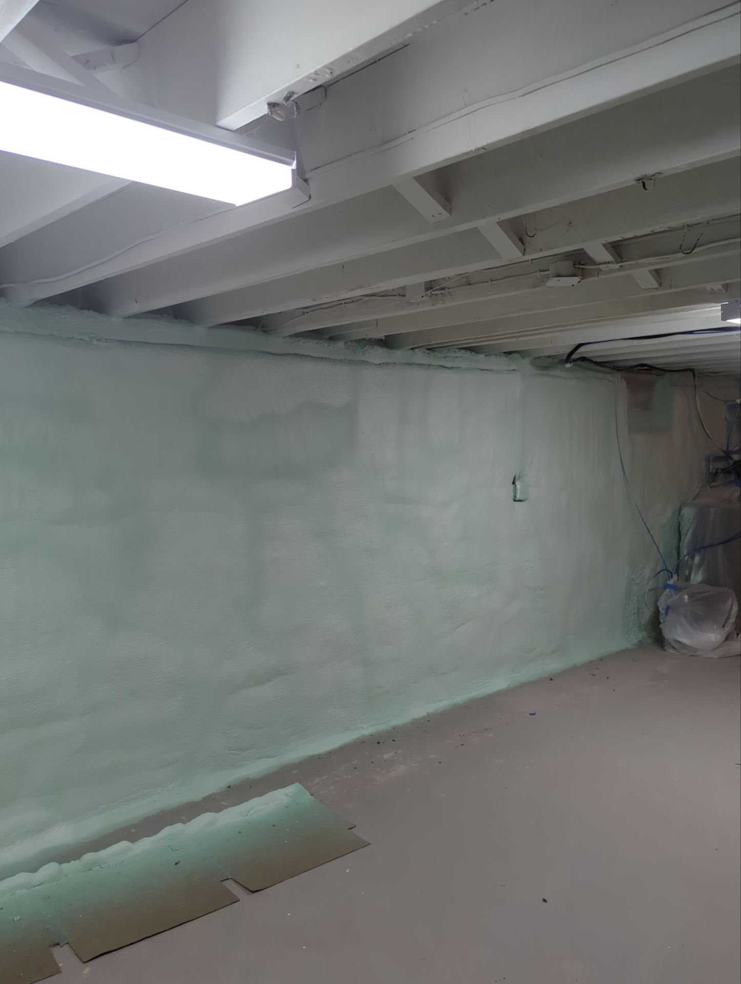 Basement Exterior Walls using Closed Cell Spray Foam by NYS Foam & Energy