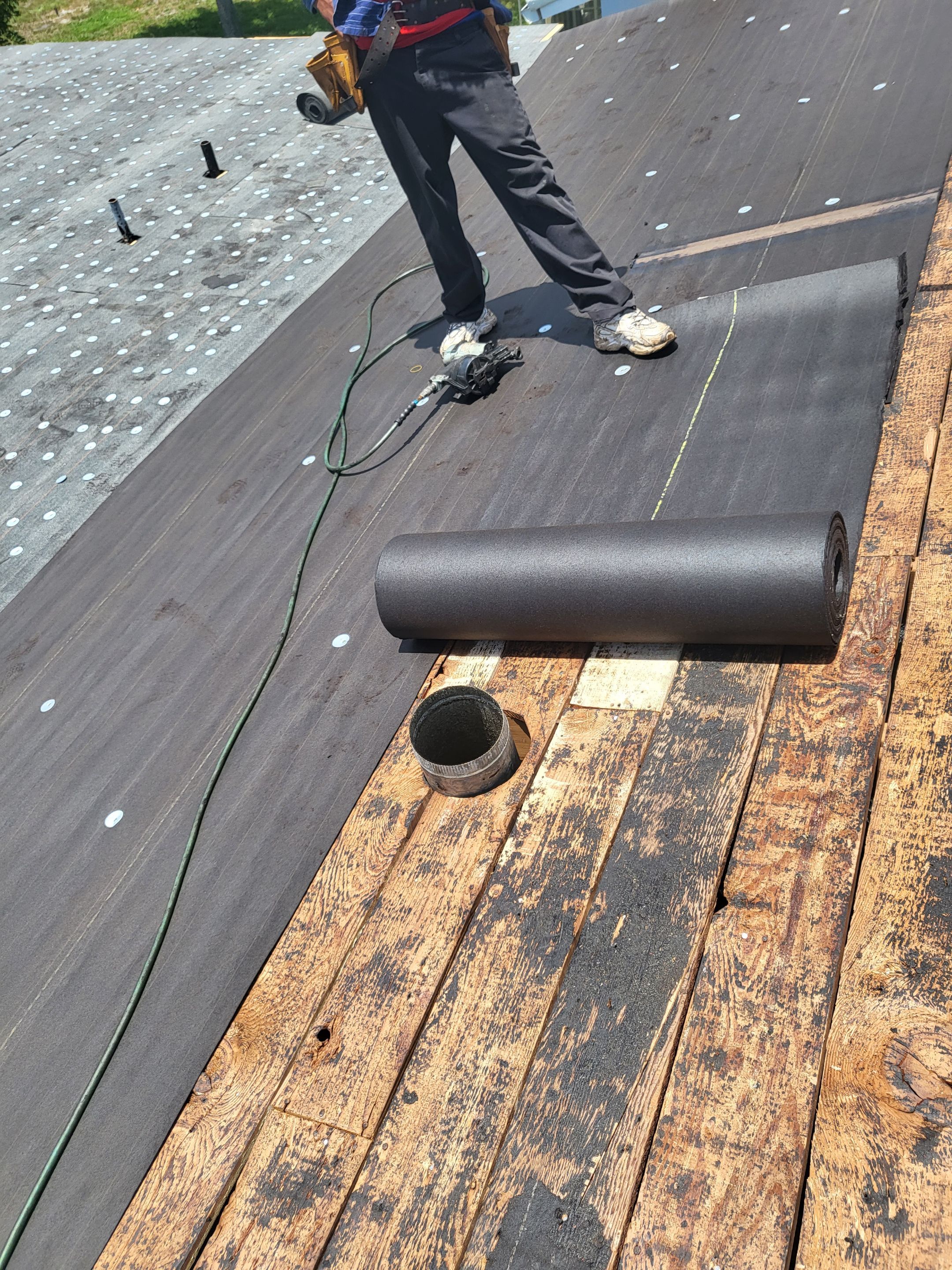 Standing Seam Metal & Flat Re-Roof using 1.5" Nail Strip 24ga Black Matte Kynar Coated Standing Seam Metal Panels by Morton Roofing, Inc.