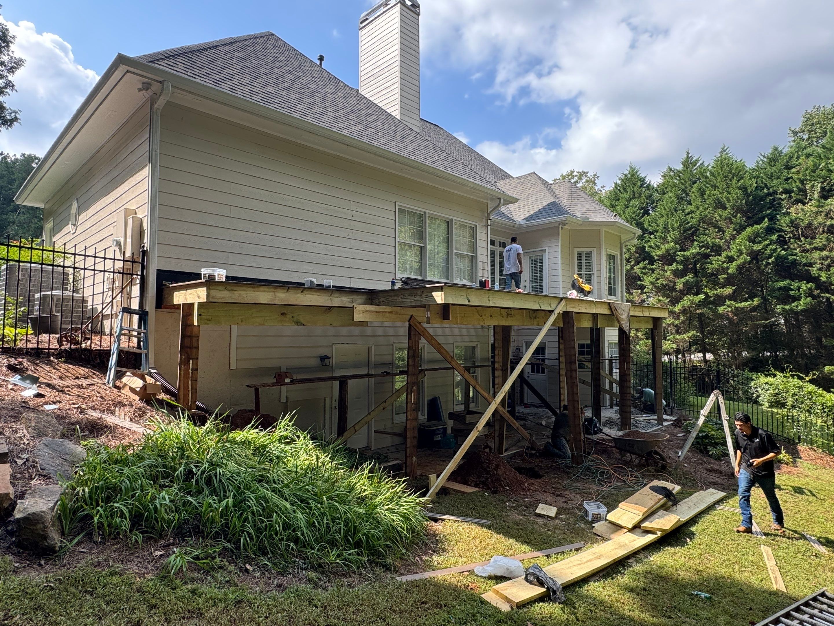 Elevated Composite Deck Replacement with Metal Railings in Smyrna by Swift Home Renovations 