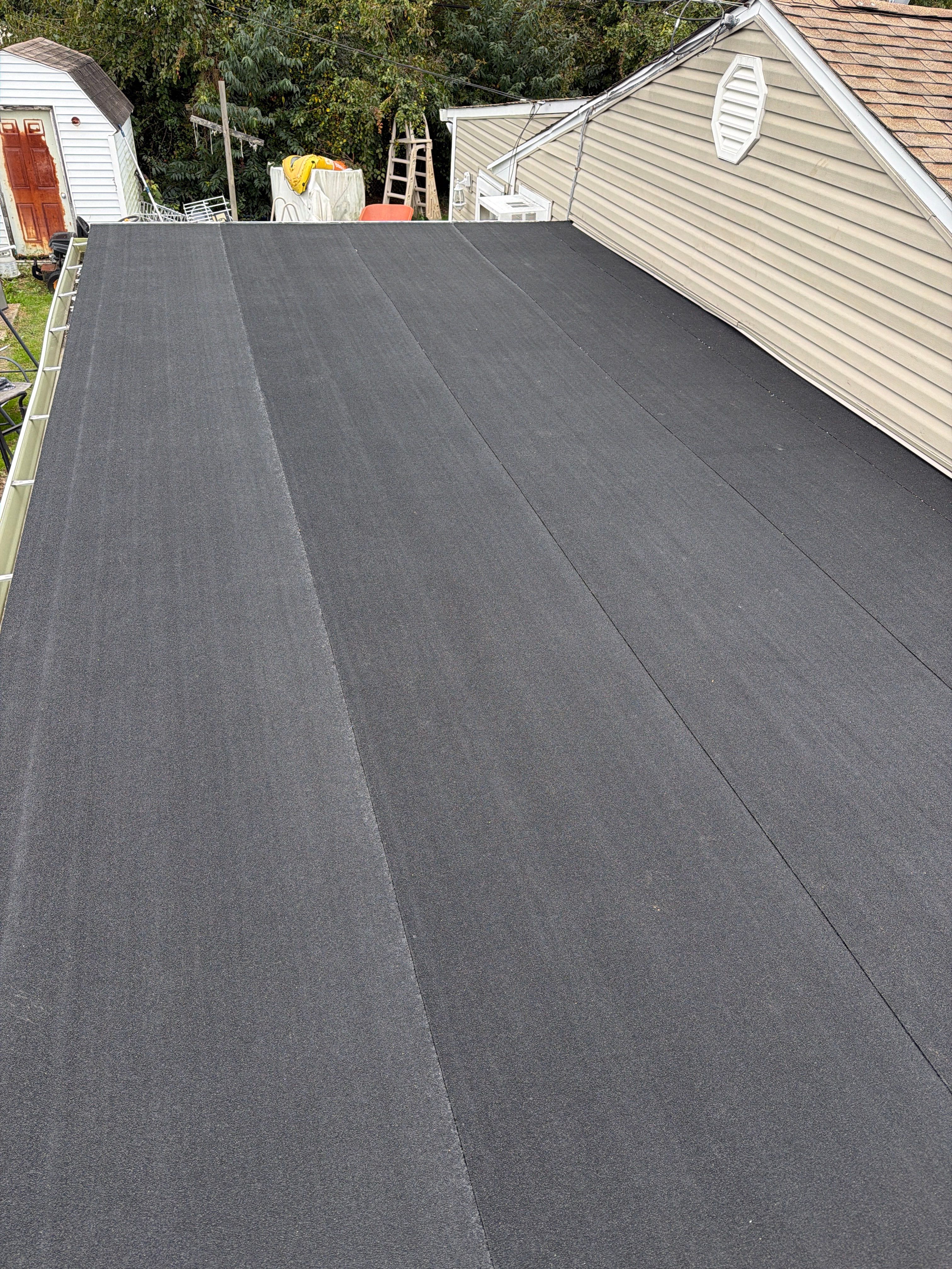 Flat Roof Replacement and Shingle Integration in Levittown by Stofan Construction LLC