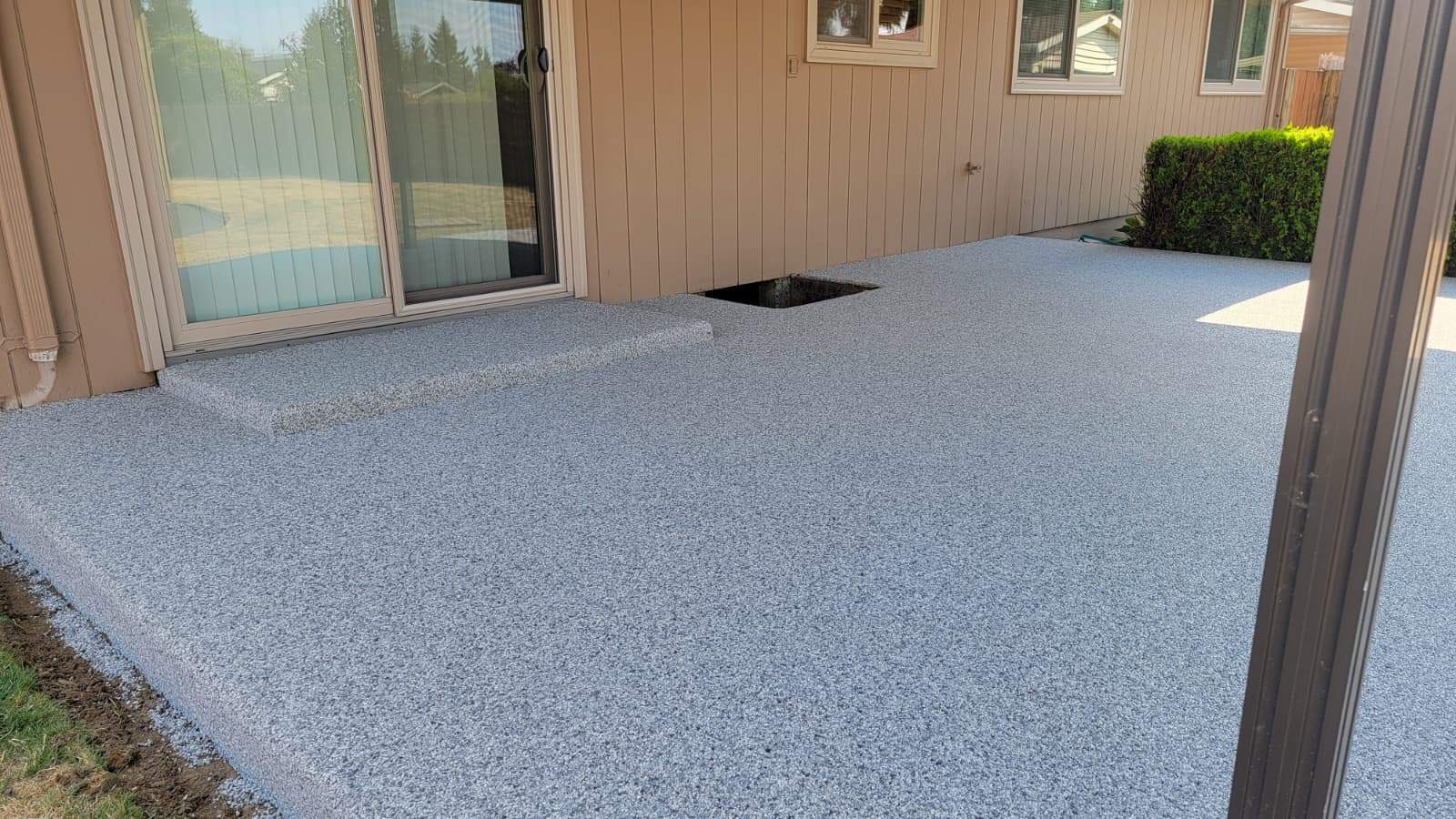 Coastal Elegance Patio in PoseidonVuba Stone by Concrete Coating Experts Inc.