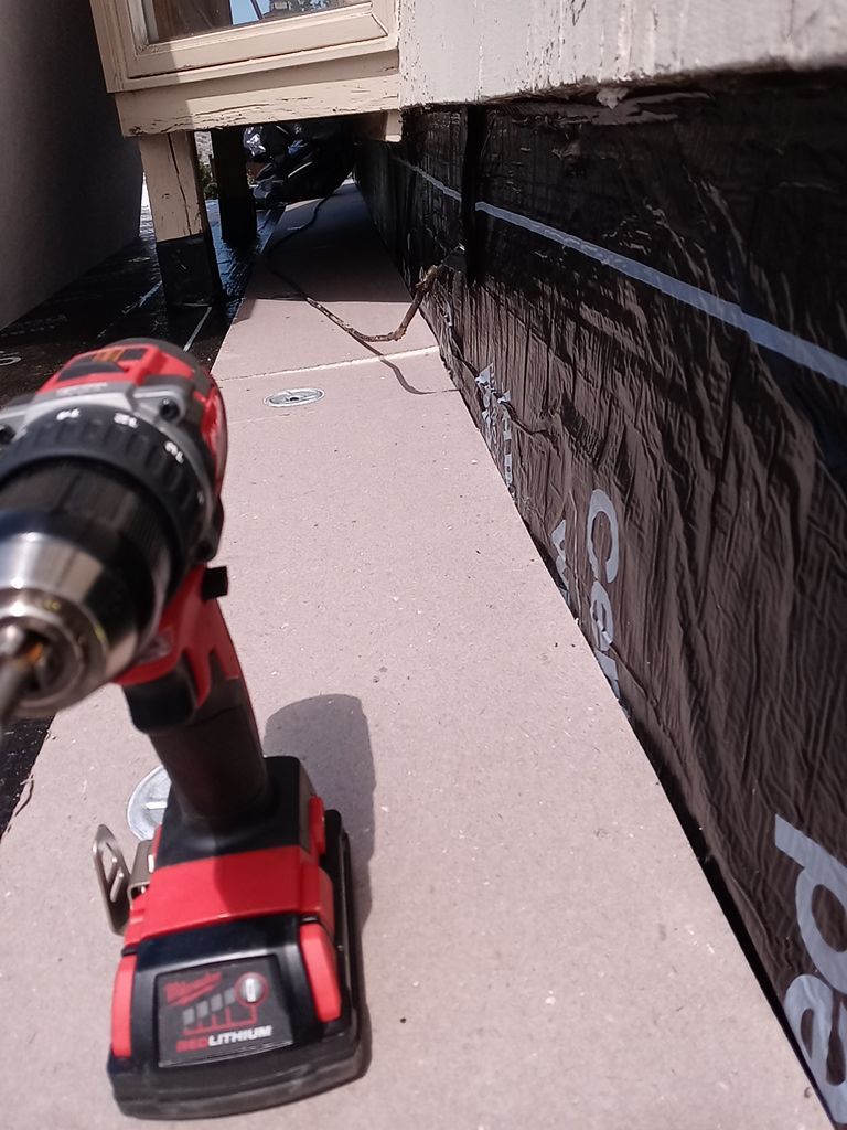 Residential Roofing Installation, Dec-tek walk-out porch roof, siding on garage by Absolute Roofing and Construction