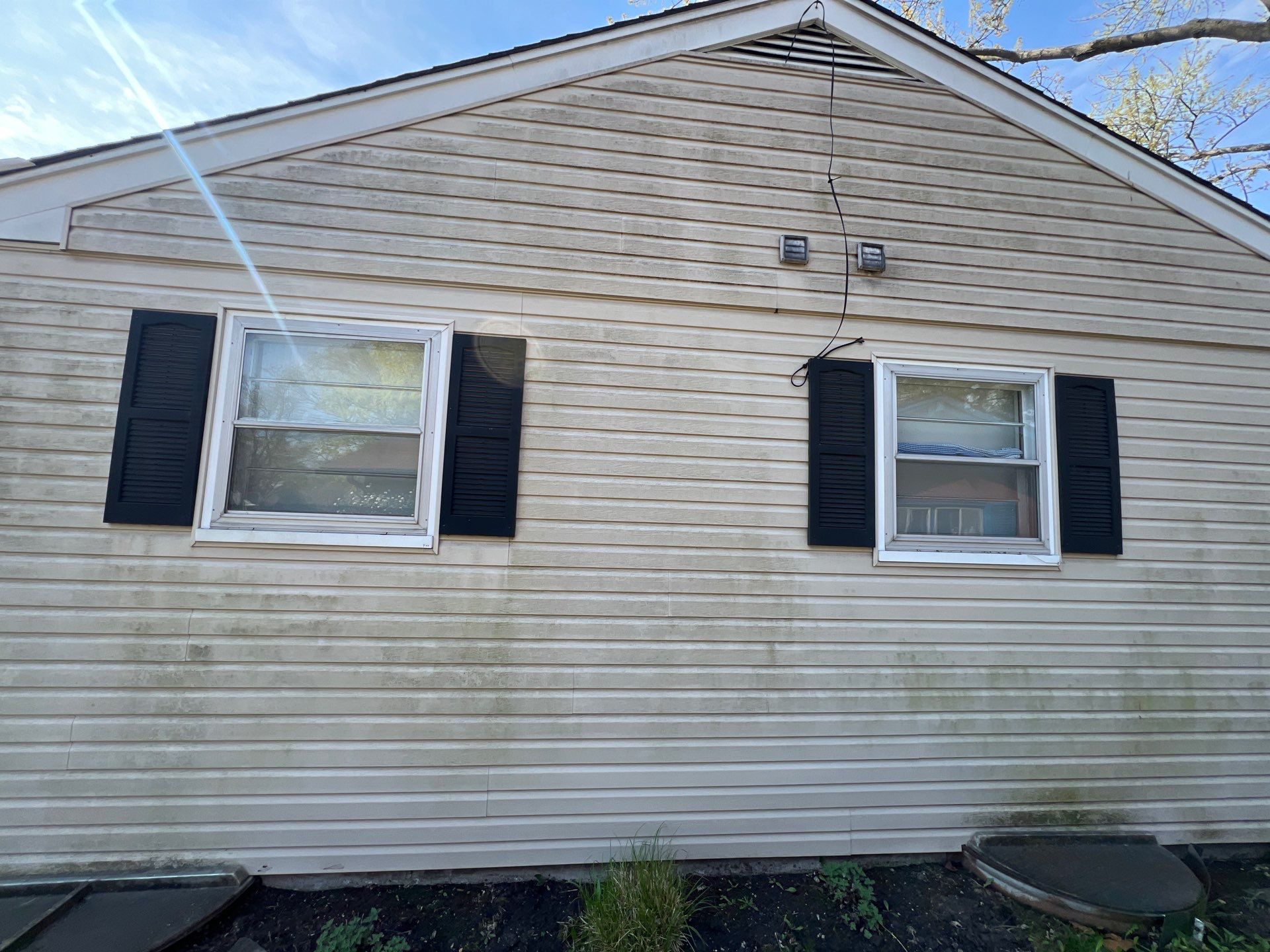 Housewashing  using Algaecide, soft wash soap by Northern Power Washing LLC.