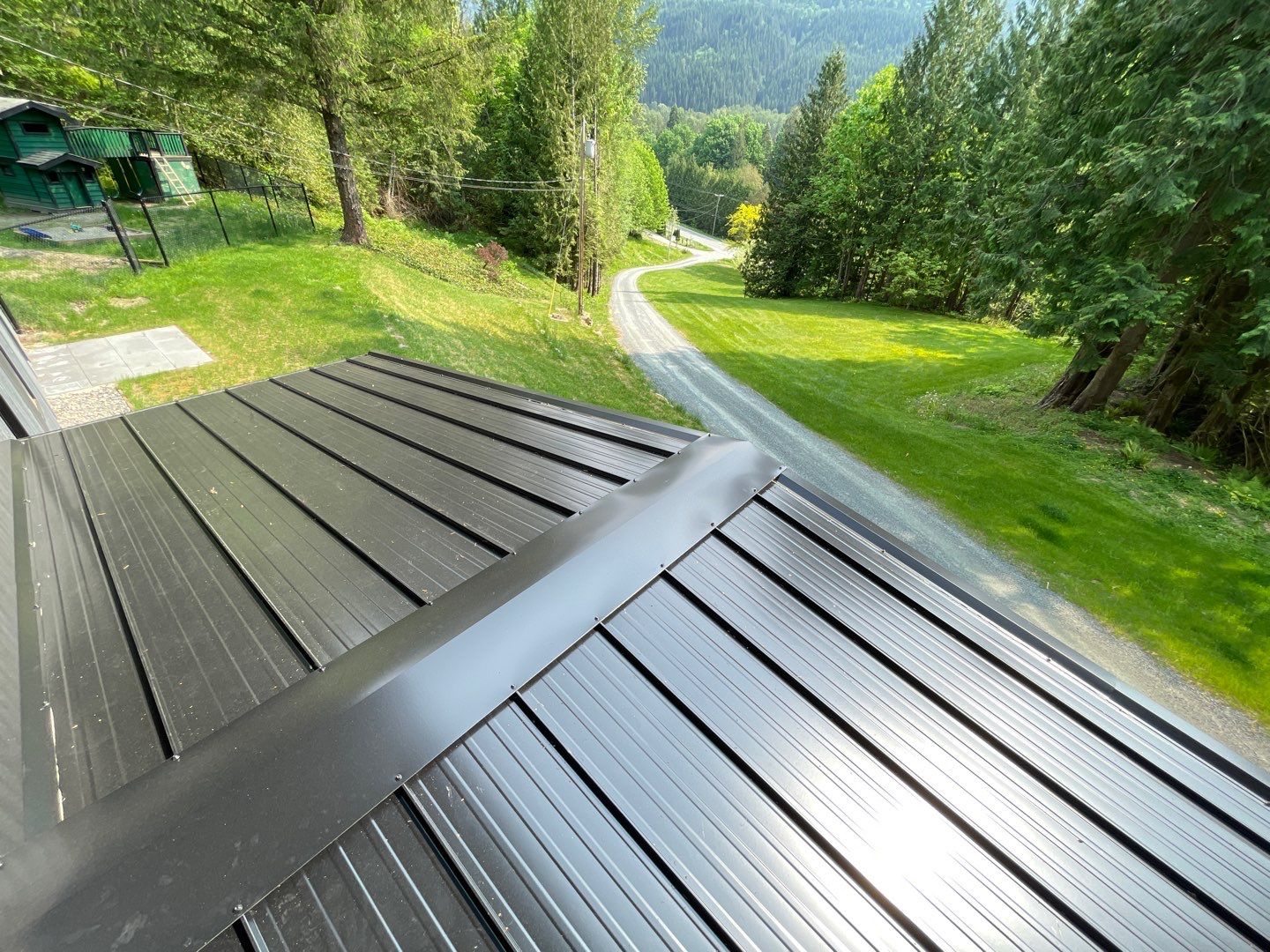 Residential ReRoofing Installation using 12" Prolok metal by Top Notch Roofing Inc