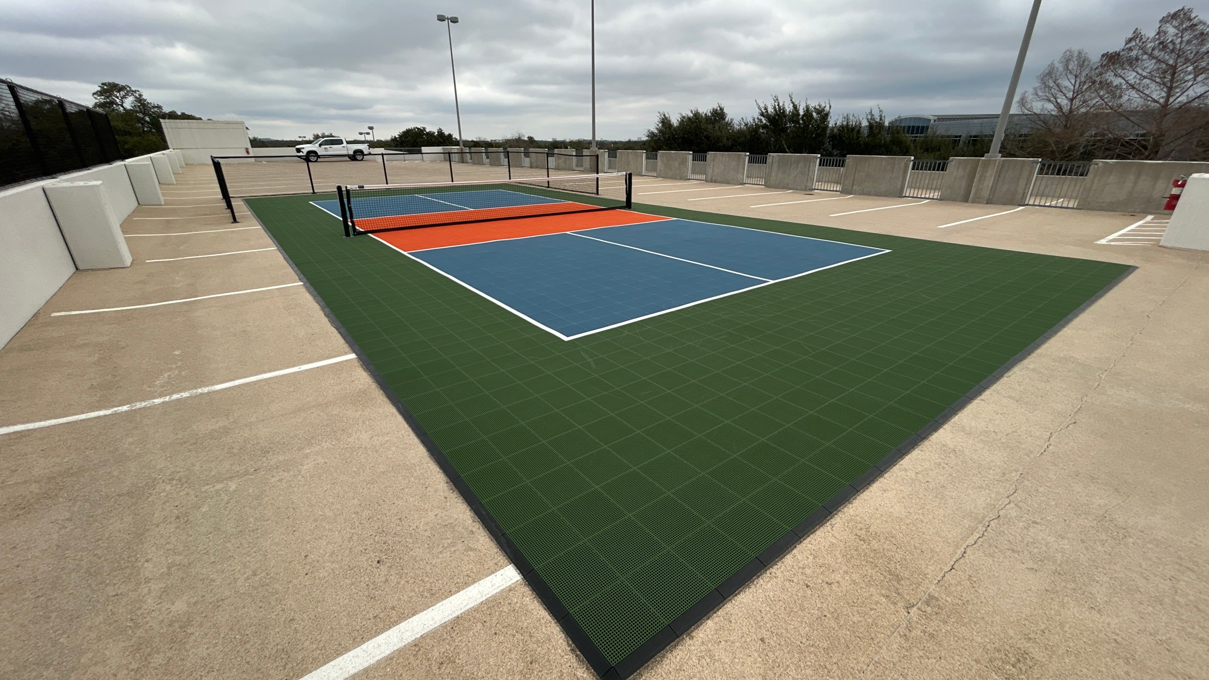 Travis Oaks Parking Garage by Sport Court Austin