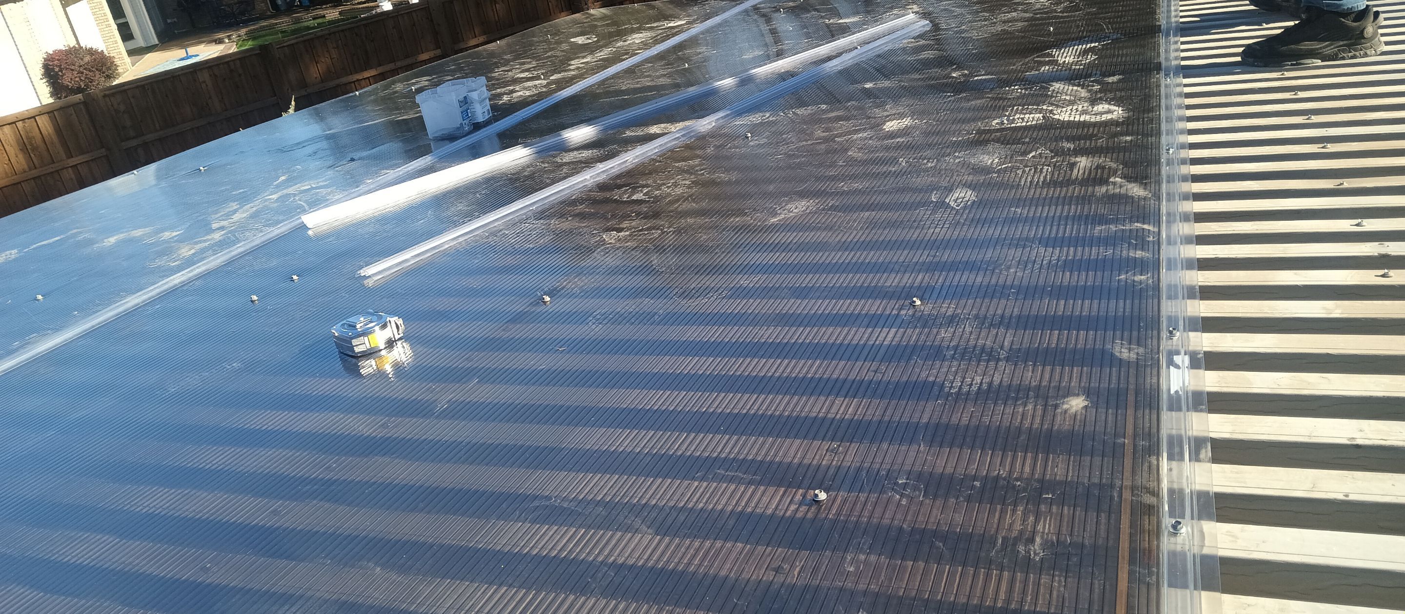 Polygal twin wall roofing system using 8mm bronze twin wall polygal by Grizzly Fence And Patio