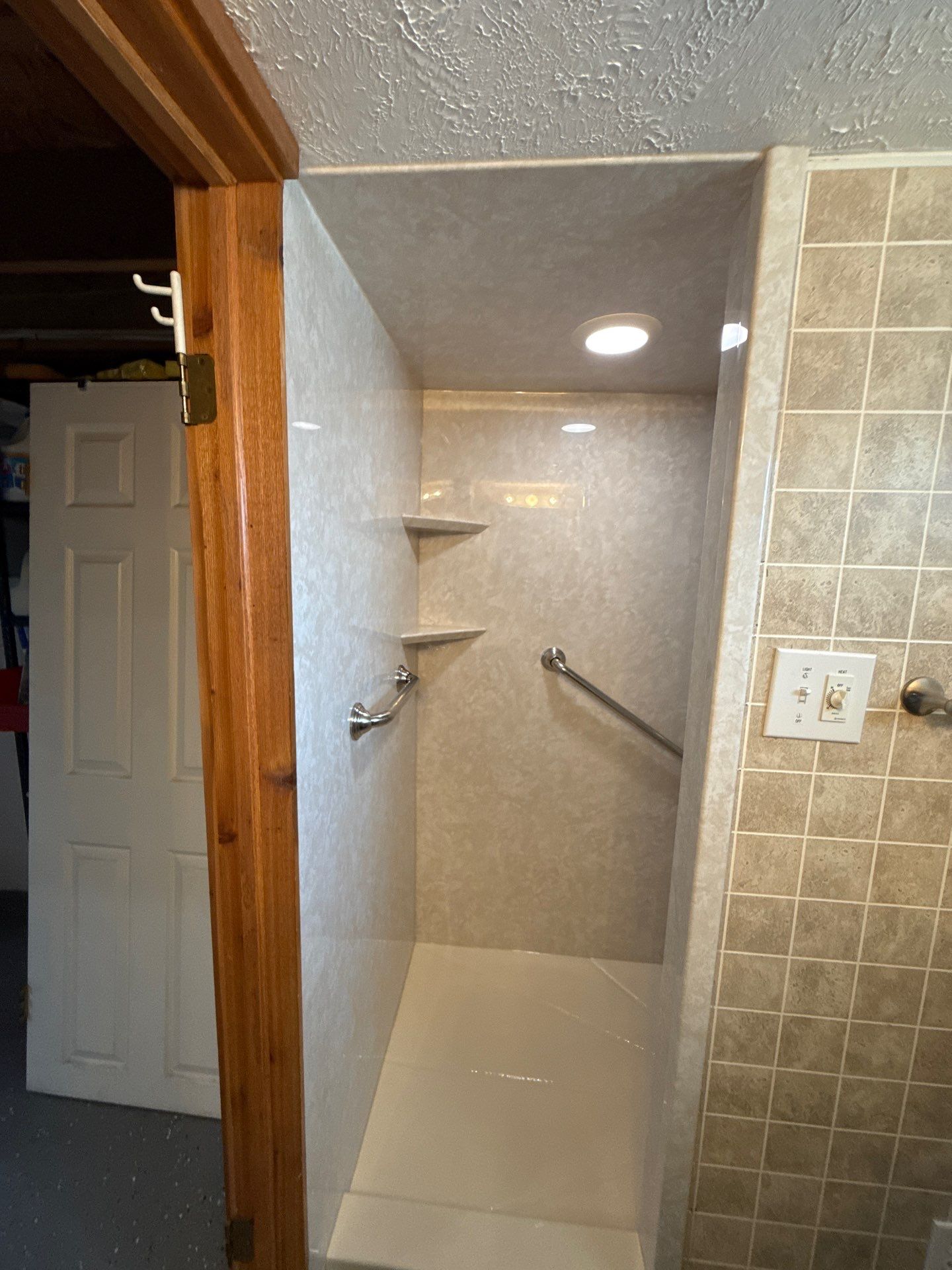 Acrylic Walk-In Shower Installation with Marble Patterns in Williamsburg by Rainbow Seamless Systems