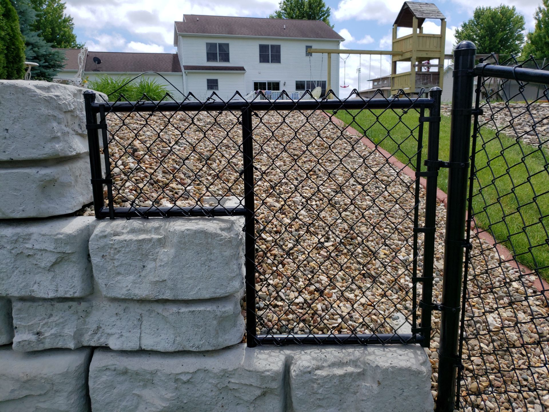 Black Vinyl-Coated Chain Link Fence Installation in Denver by Perfect Picket Fence and Stain
