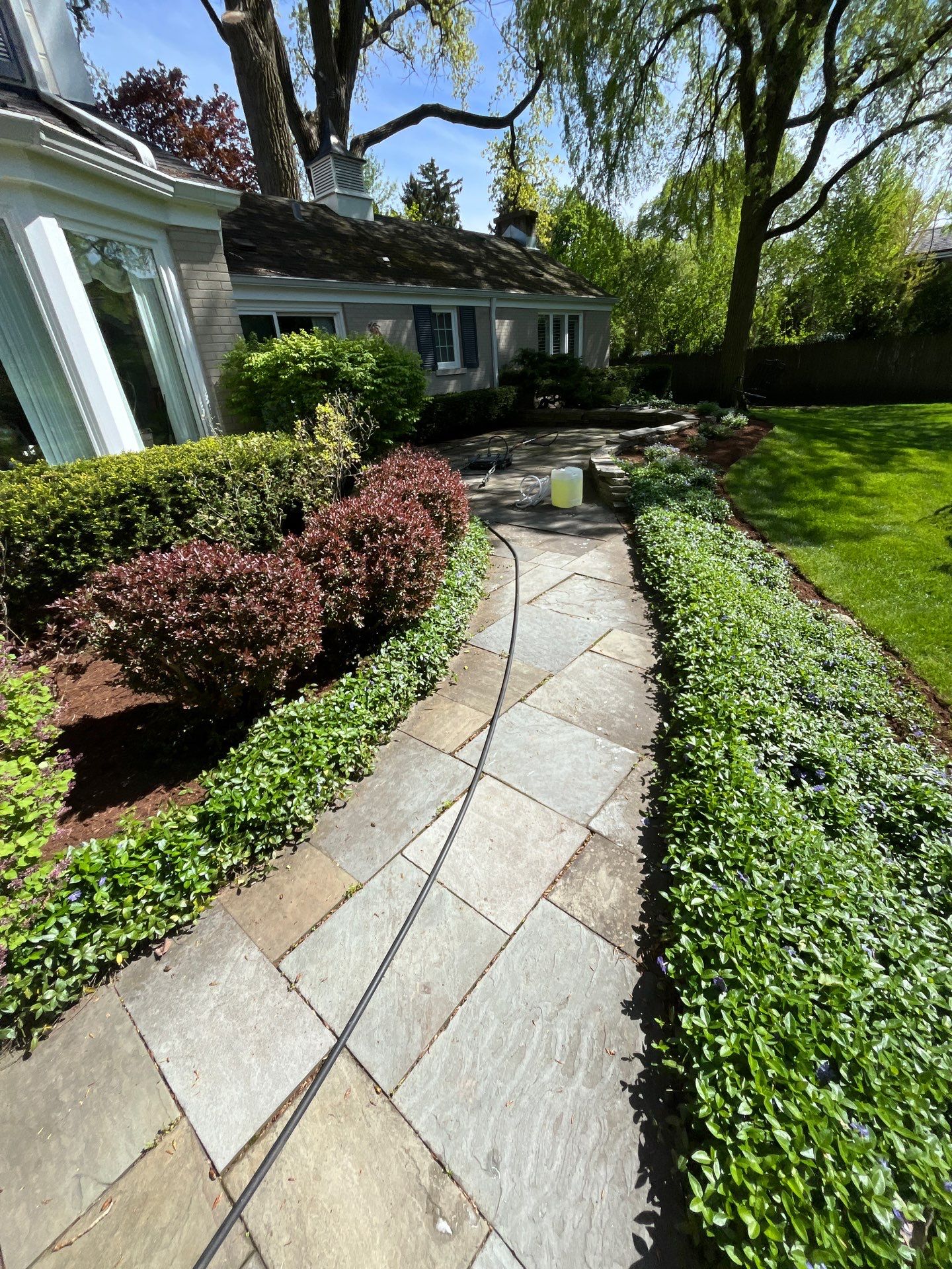 natural stone using Algaecide, soft wash soap by Northern Power Washing LLC.