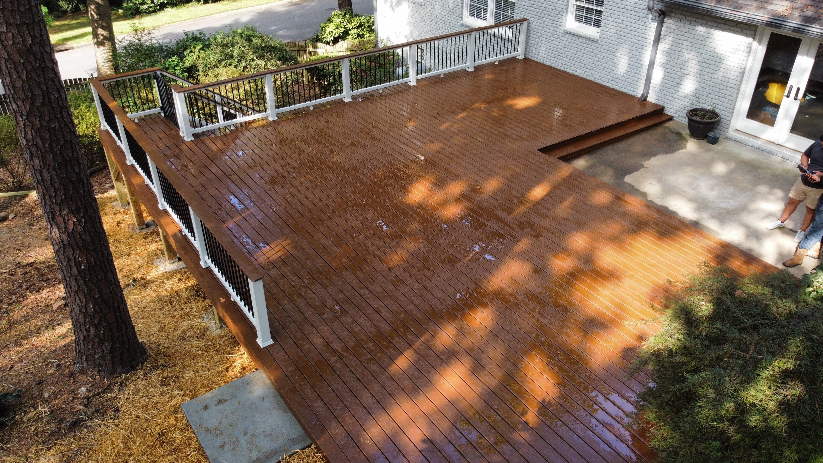 Custom Stained Wood Deck Installation with White Railings in Atlanta by Swift Home Renovations