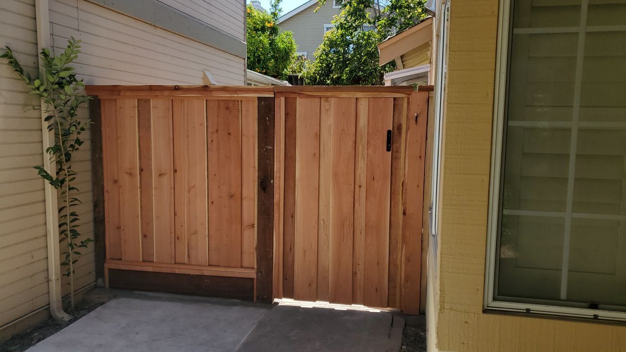 Board on Board & 3' high retaining wall by Fremont Fence Inc