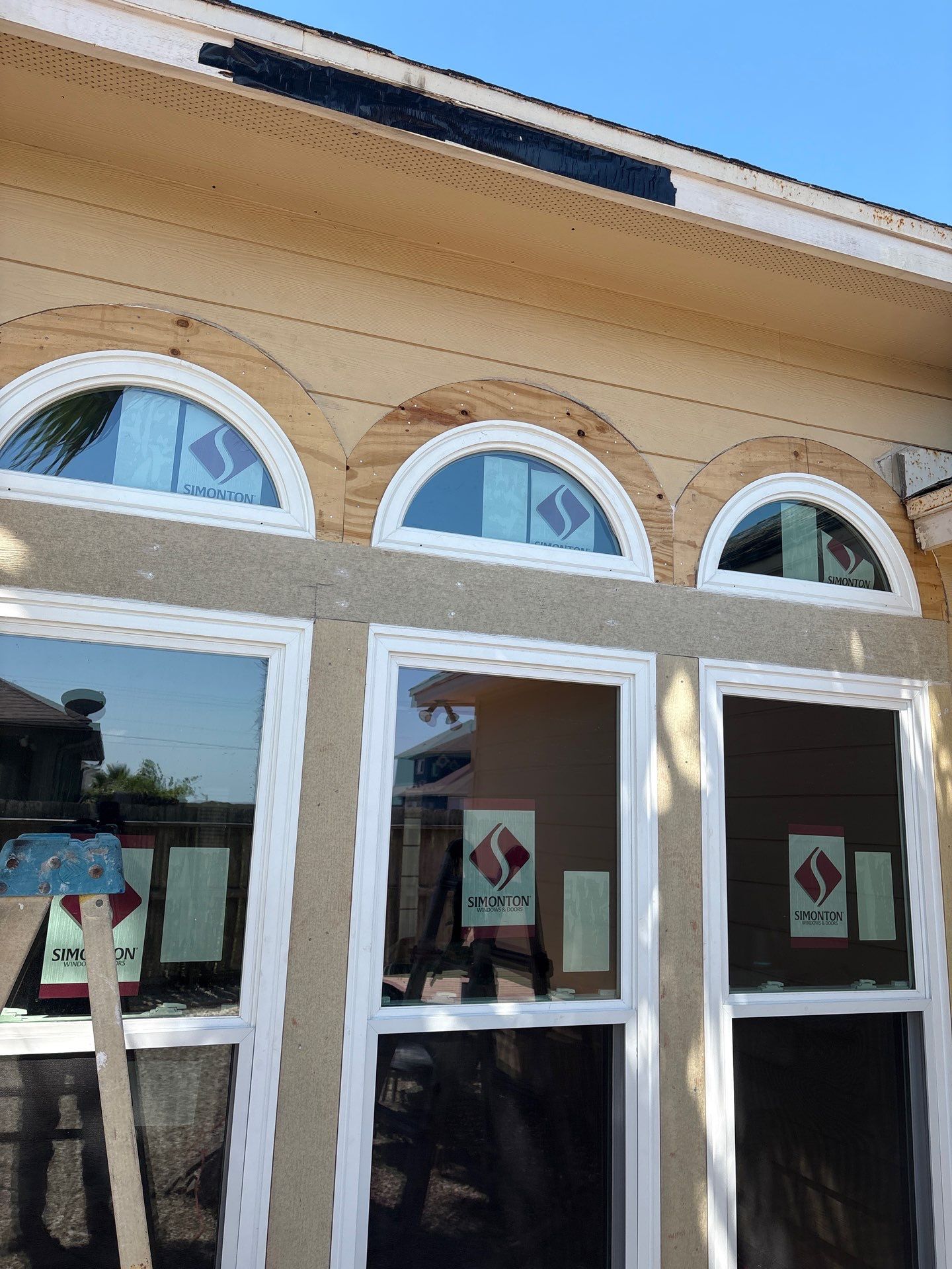 Curved Trim Windows by Bayfront Roofing and Construction