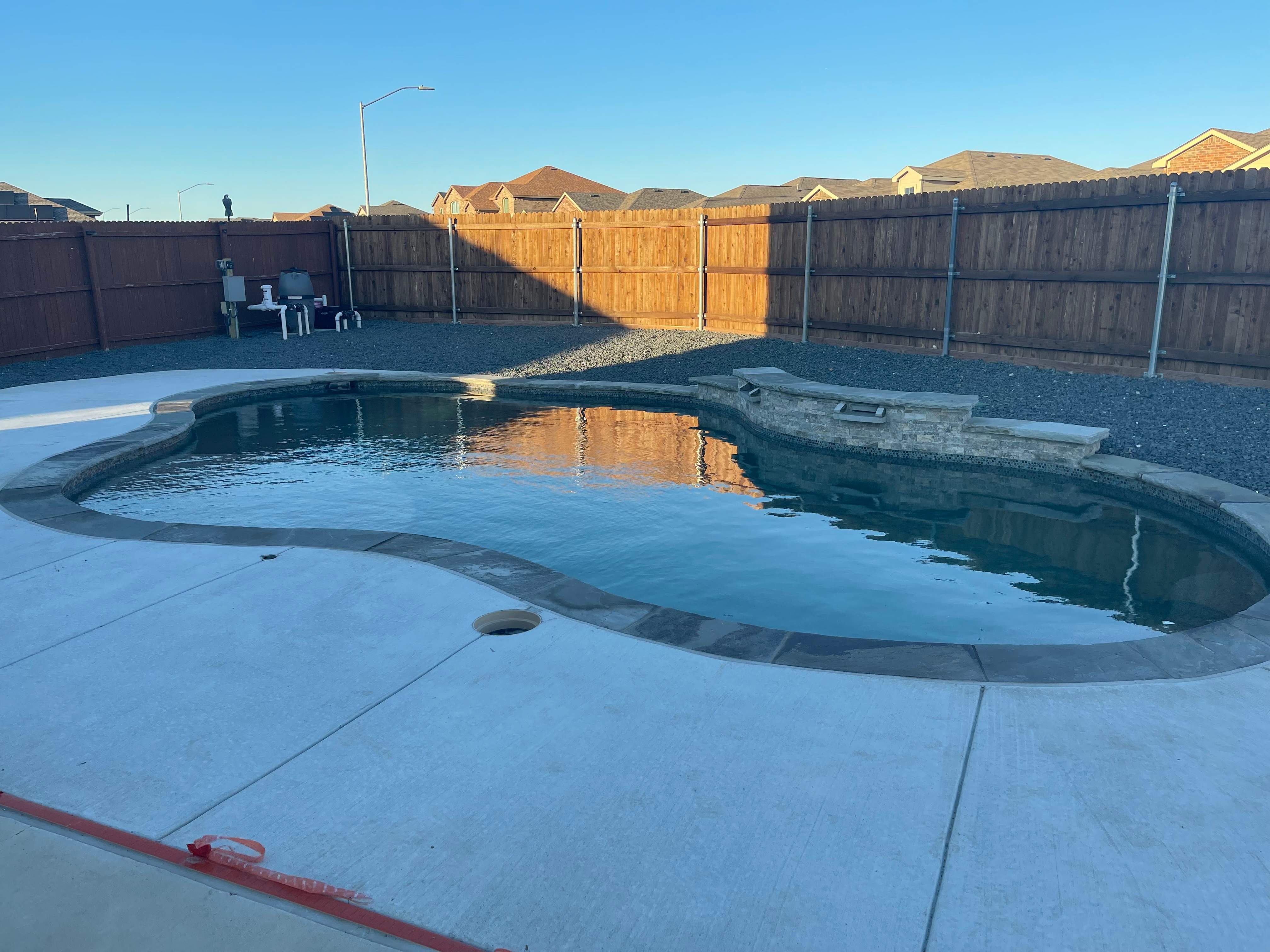 Freeform Pool with Sun Shelf by Pinnacle Pools and Spas - DFW