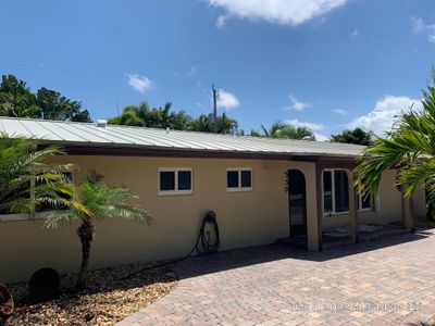Residential Roofing Installation using 1" Nail strip metal roof
