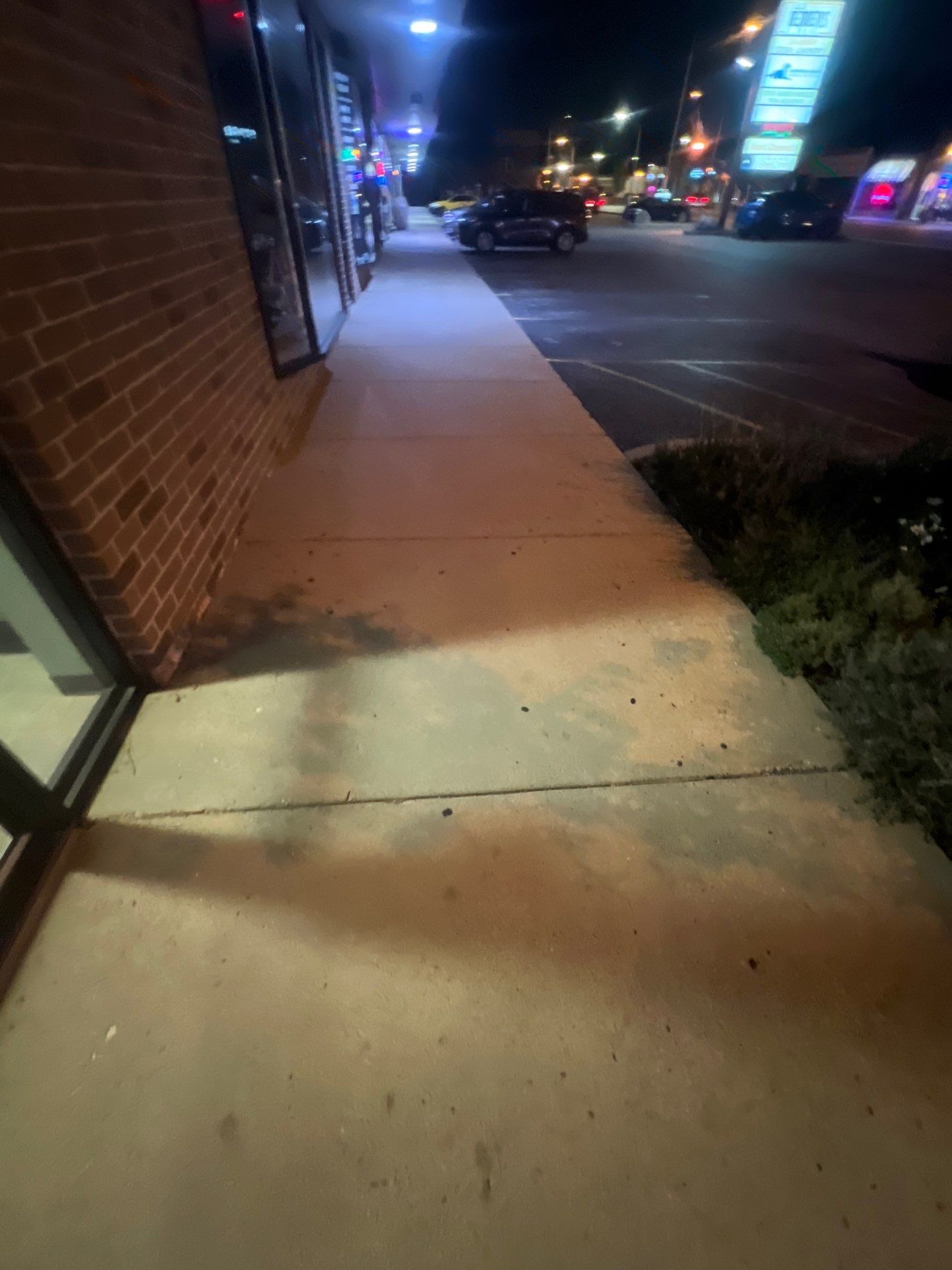 Commercial sidewalk cleaning. by Northern Power Washing LLC.